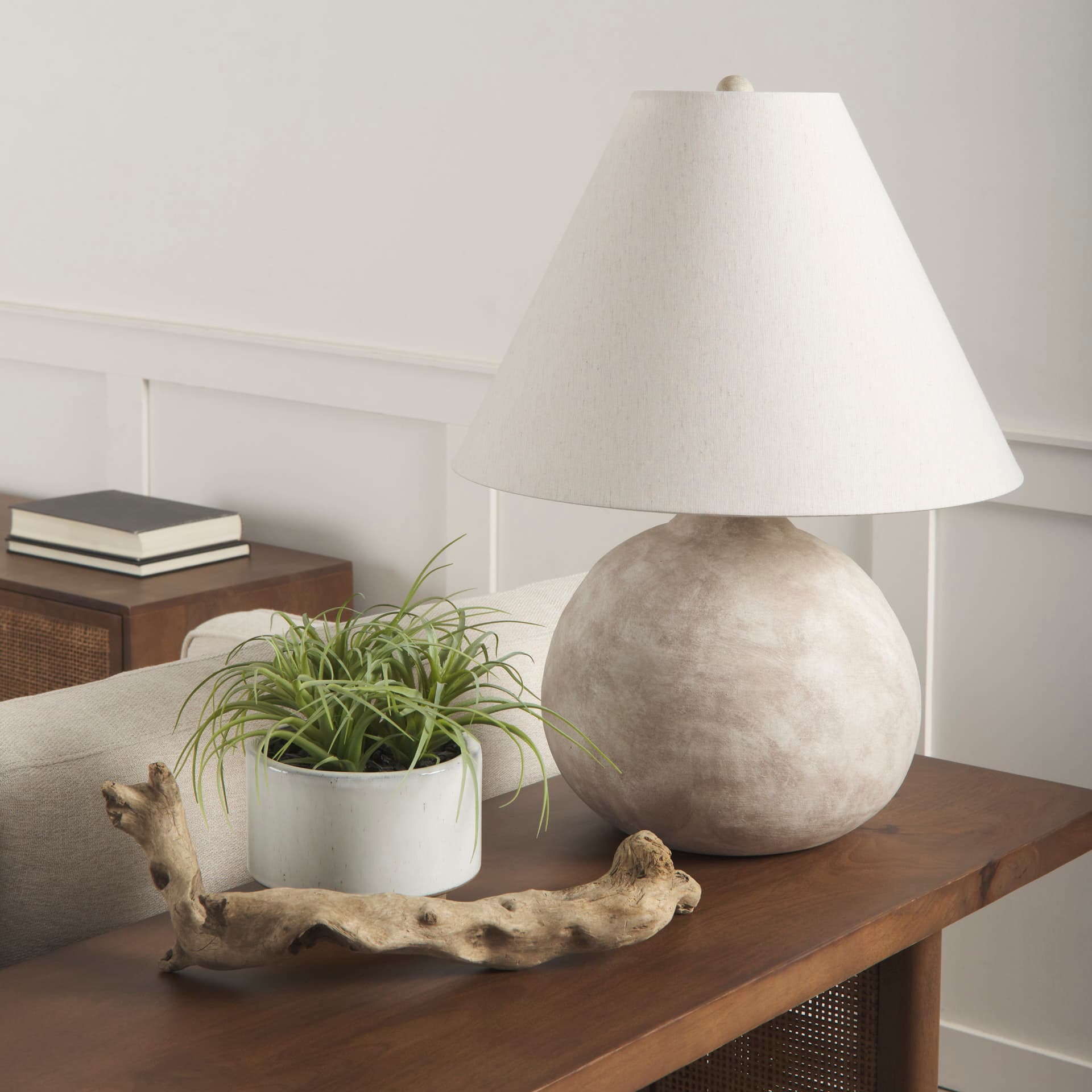 Mehdi Cream Ceramic Table Lamp — in a styled room