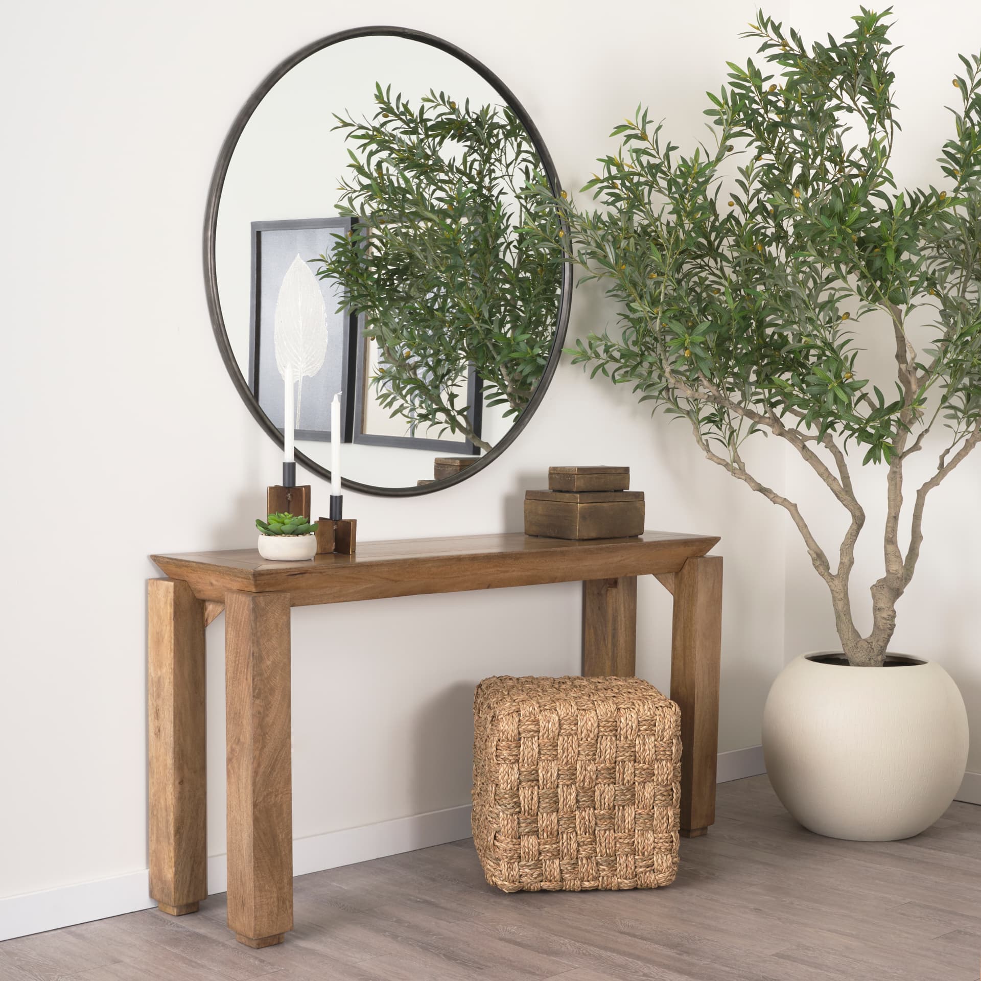 Adele 17.7L x 17.7W x 17.7H Medium Brown Seagrass Woven Square Pouf — in a styled room