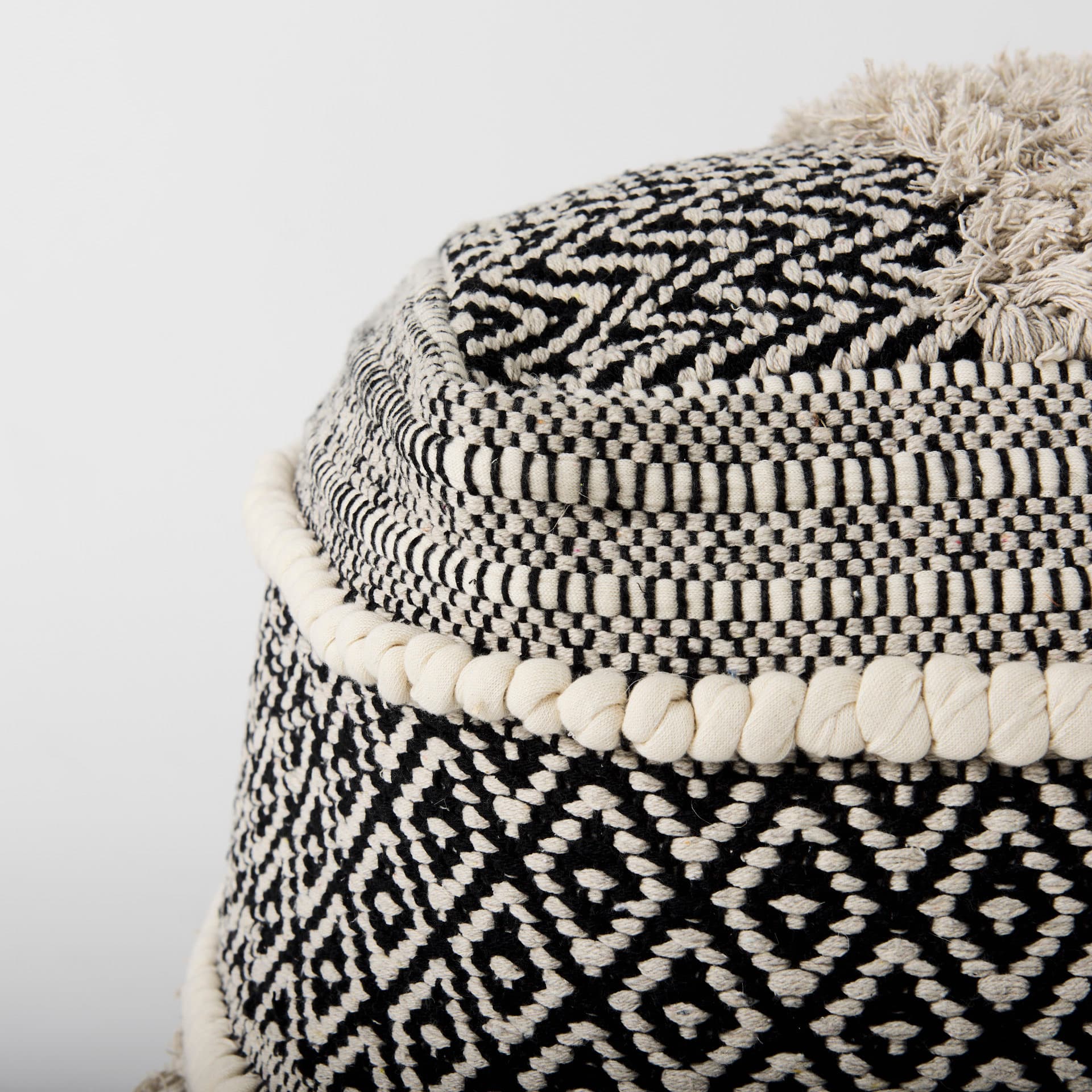 Darika 16.0L x 16.0W x 16.0H Black/White/Gray Cotton Pouf — product photograph