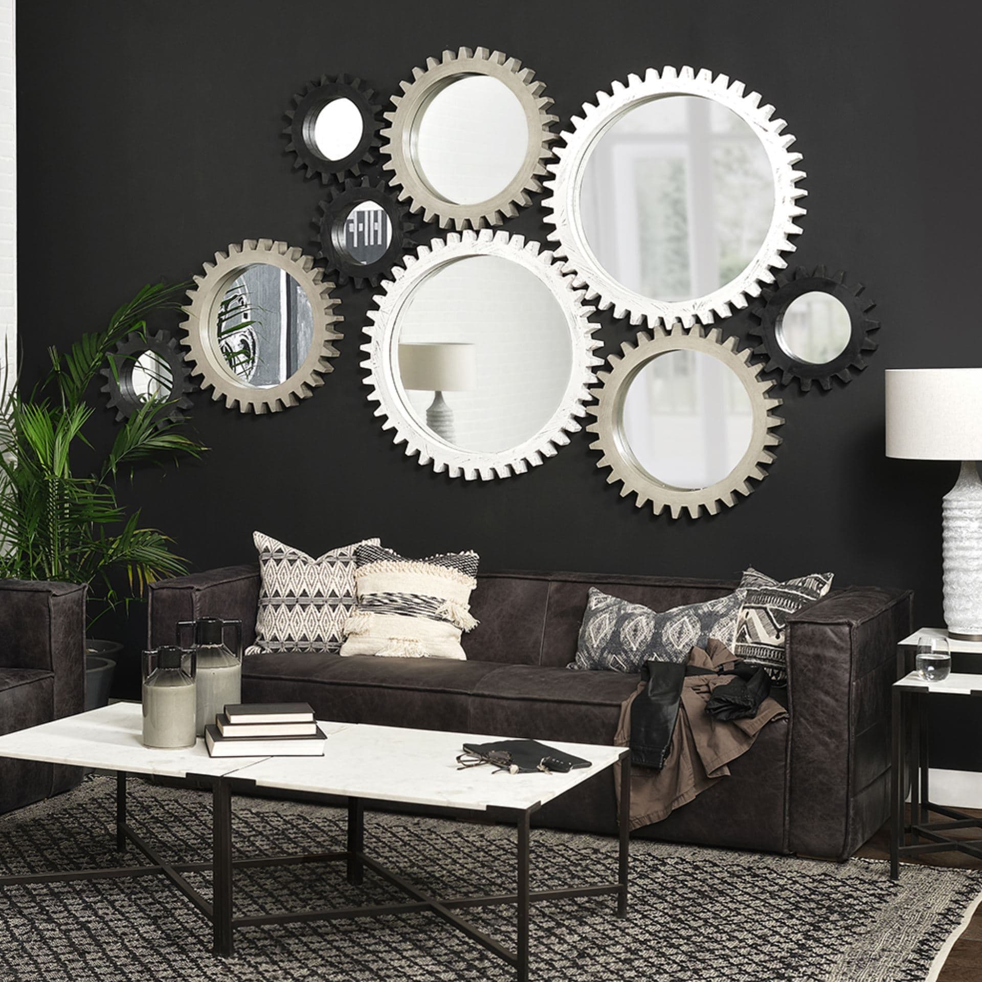Sundance Cog 17" Round Black Wood Frame Mirror — in a styled room