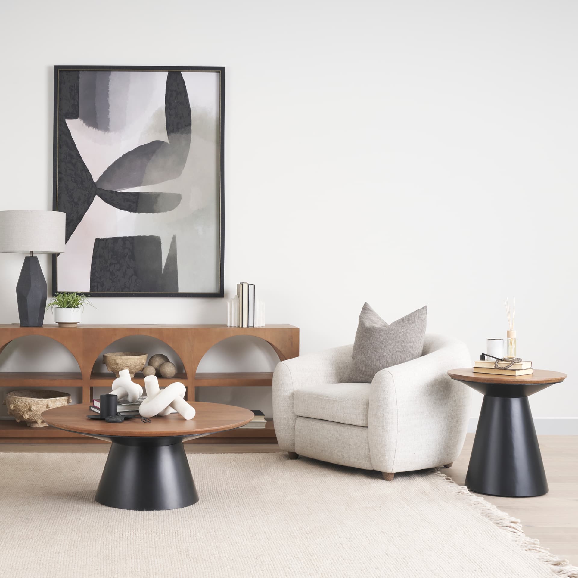 Mitchell 22.0L x 22.0W x 23.0H Black Metal Pedetal Base with Brown Wood Top Side Table — in a styled room