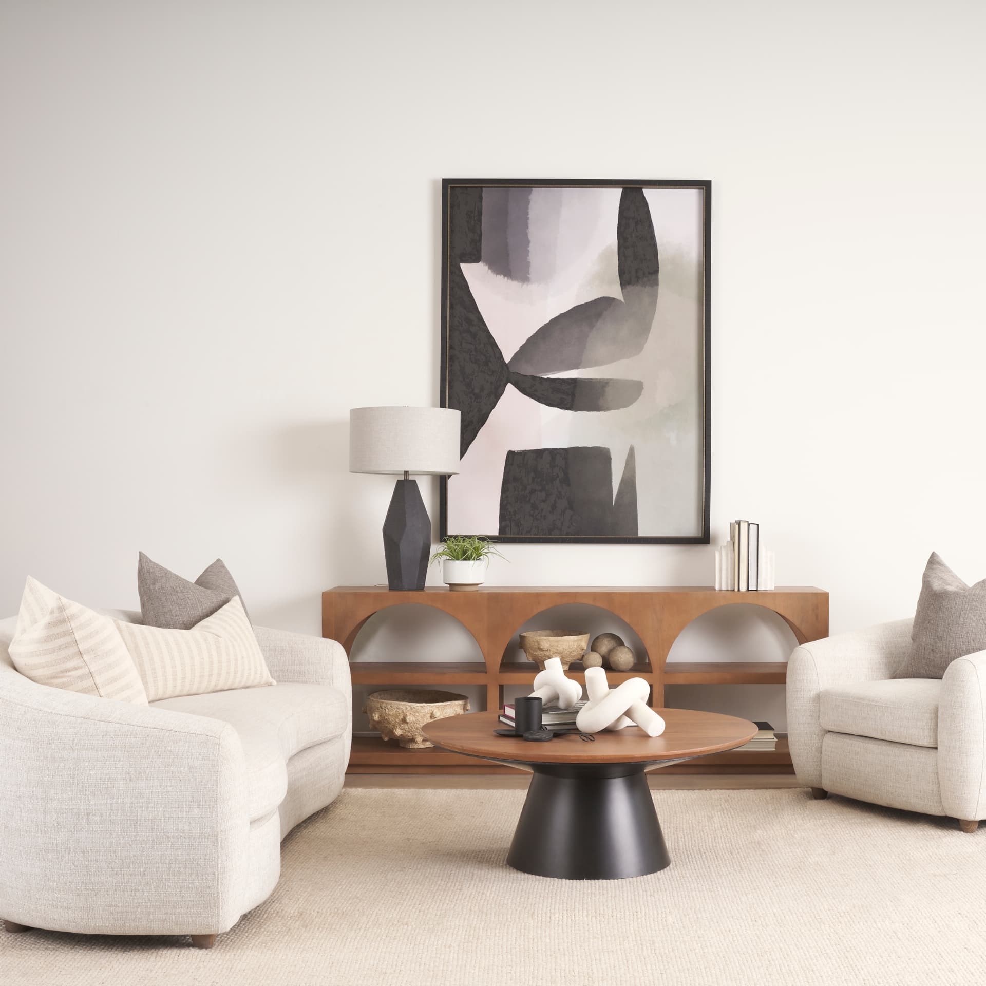 Mitchell 40.0L x 40.0W x 16.0H Black Metal Pedestal Base with Brown Wood Top Coffee Table — product photograph