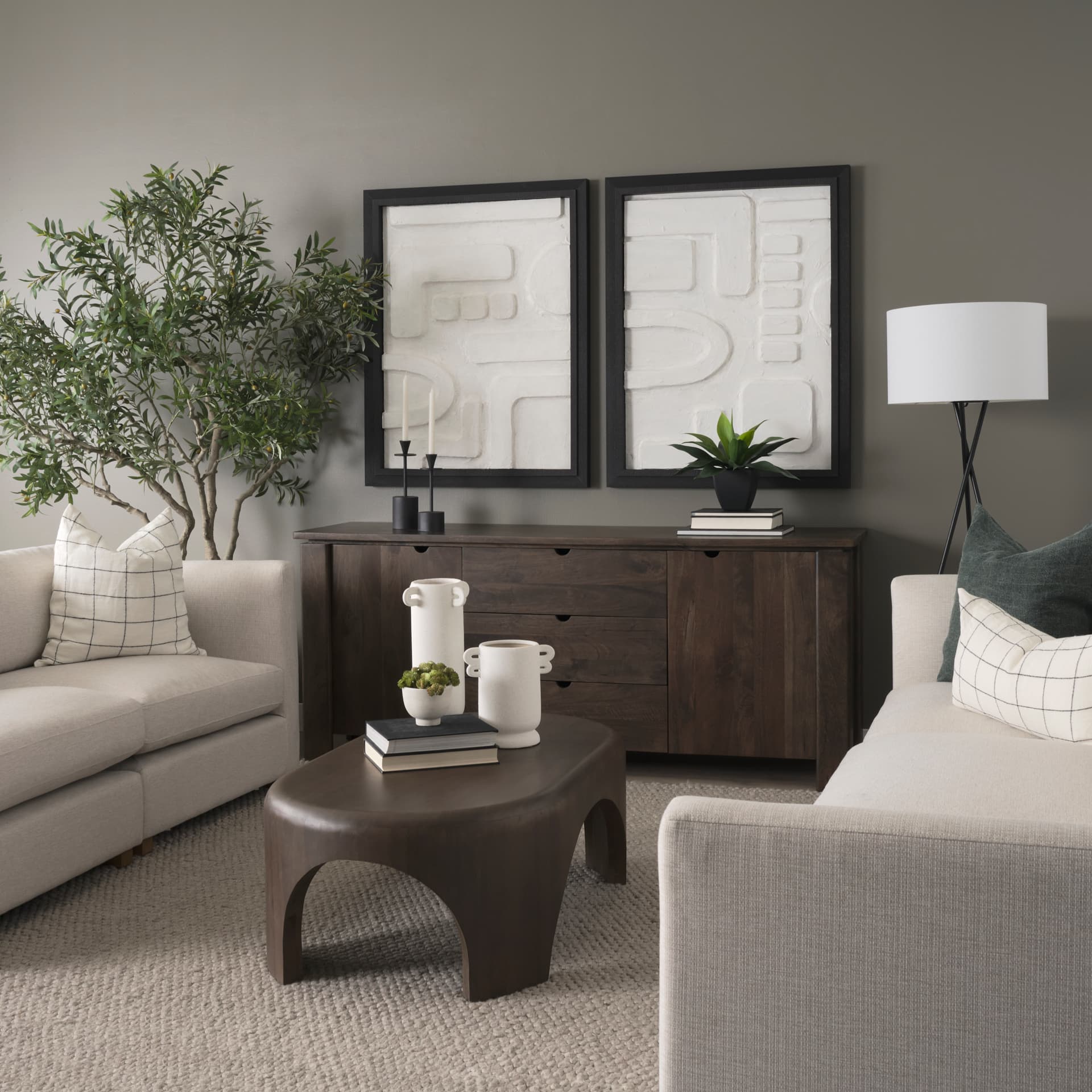 Shima Oval Dark Brown Wood w/ Arched Legs Coffee Table — in a styled room