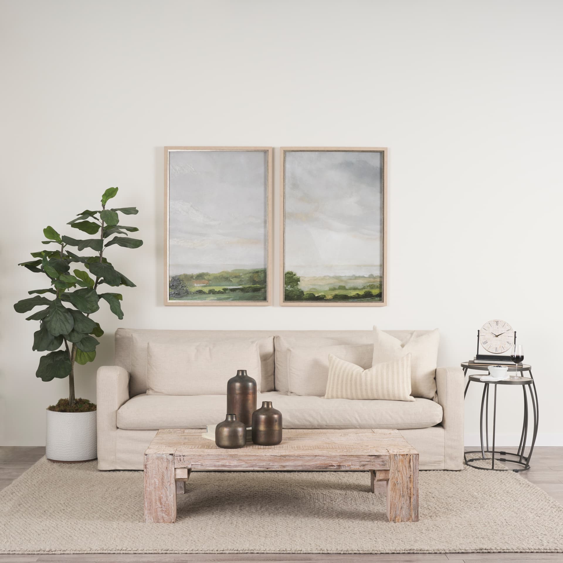 Daya Short Antiqued Gold Metal Vase — in a styled room