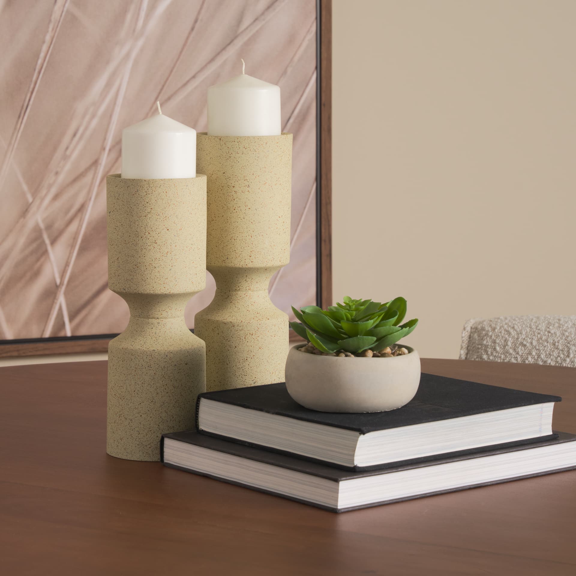 Akira Small Textured Beige Metal Pillar Candle Holder — in a styled room