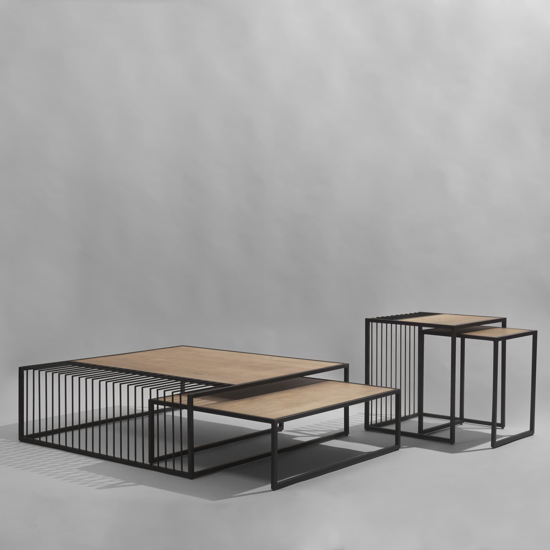 Miles Black Metal w/ Light Wood Nesting End/Side Table — in a styled room