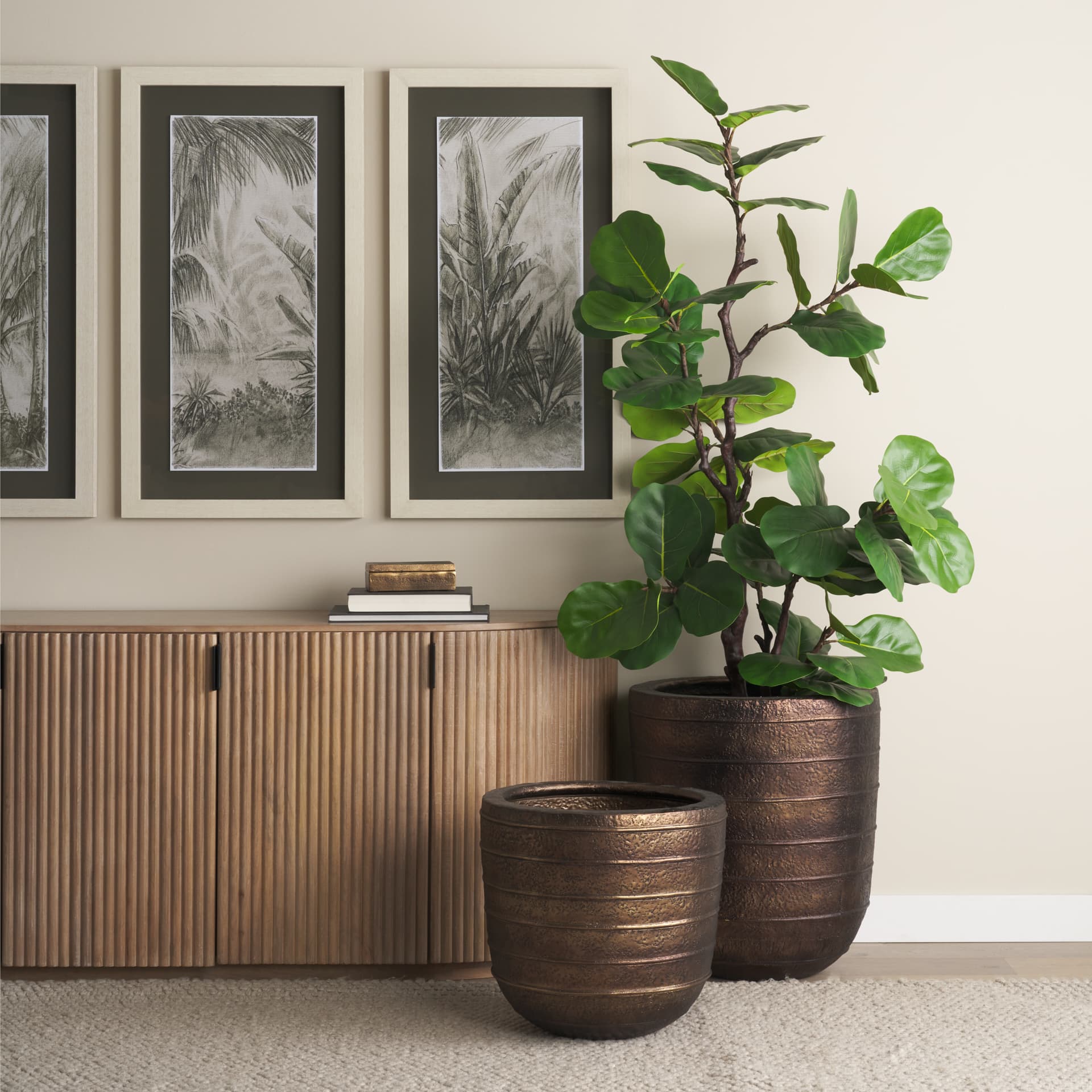 Aivana Large Antiqued Gold Metal Floor Vase — in a styled room