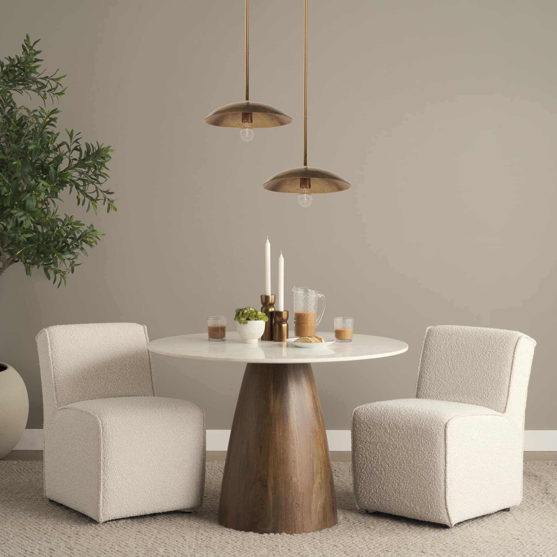 Garnet 13L x 13W Gold Hammered Metal Pendant Light — in a styled room