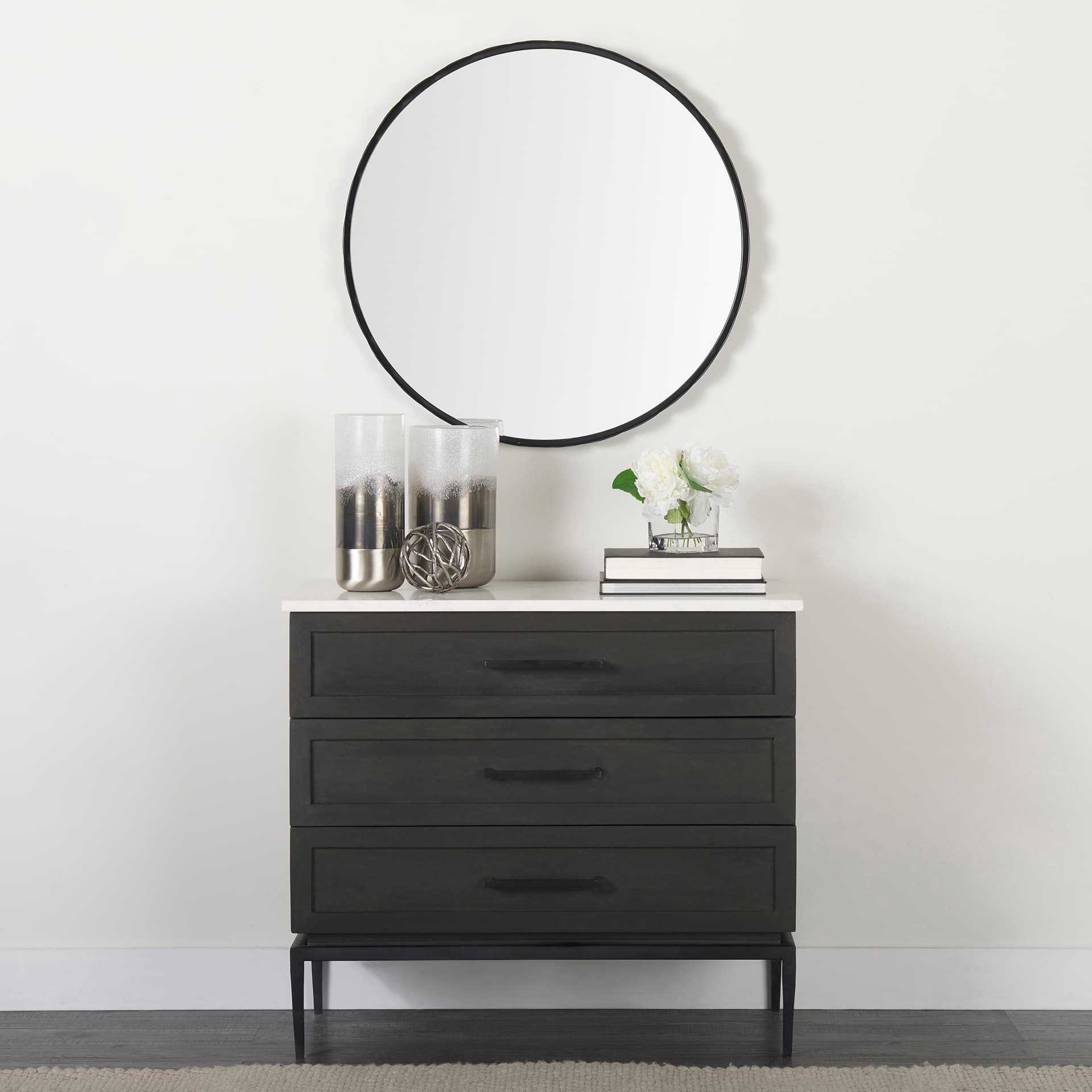 Adelaide 29.7"Black Metal Scallop Edge Round Mirror — in a styled room
