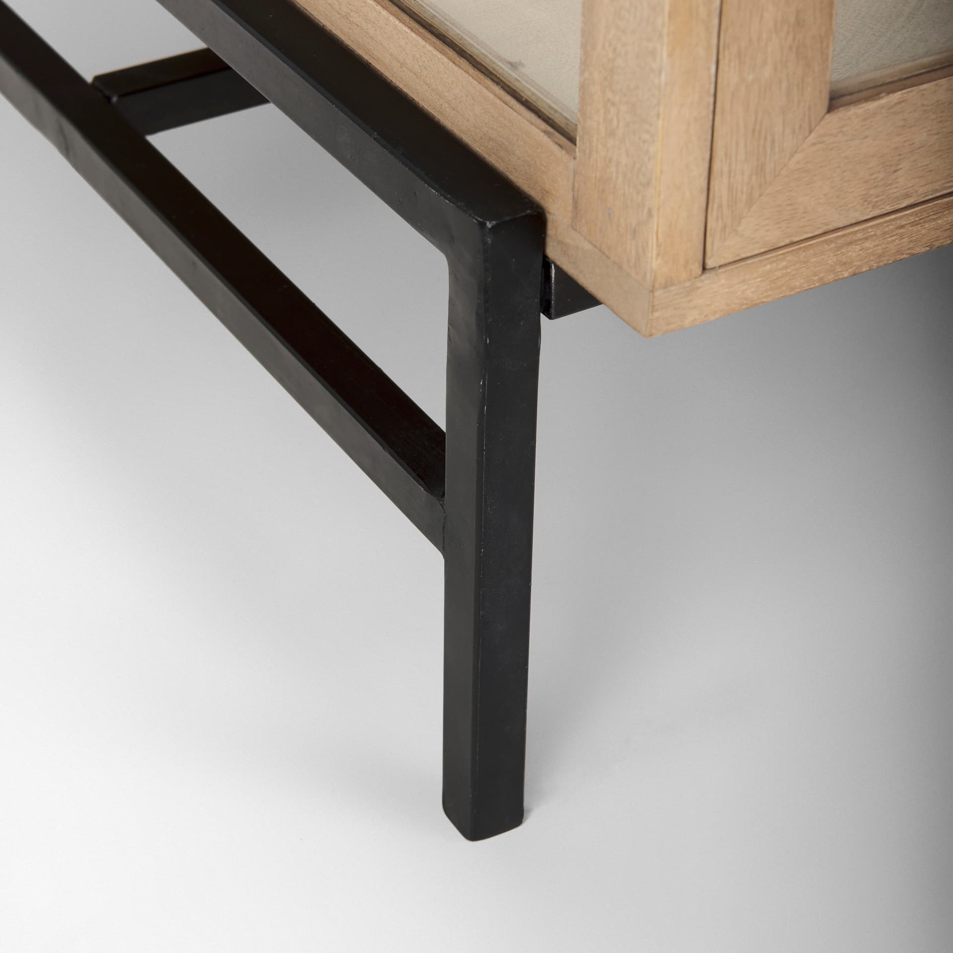 Arelius 49.5"L Rectangular Light Brown Wood w/ Black Metal Base Display Coffee Table — product photograph