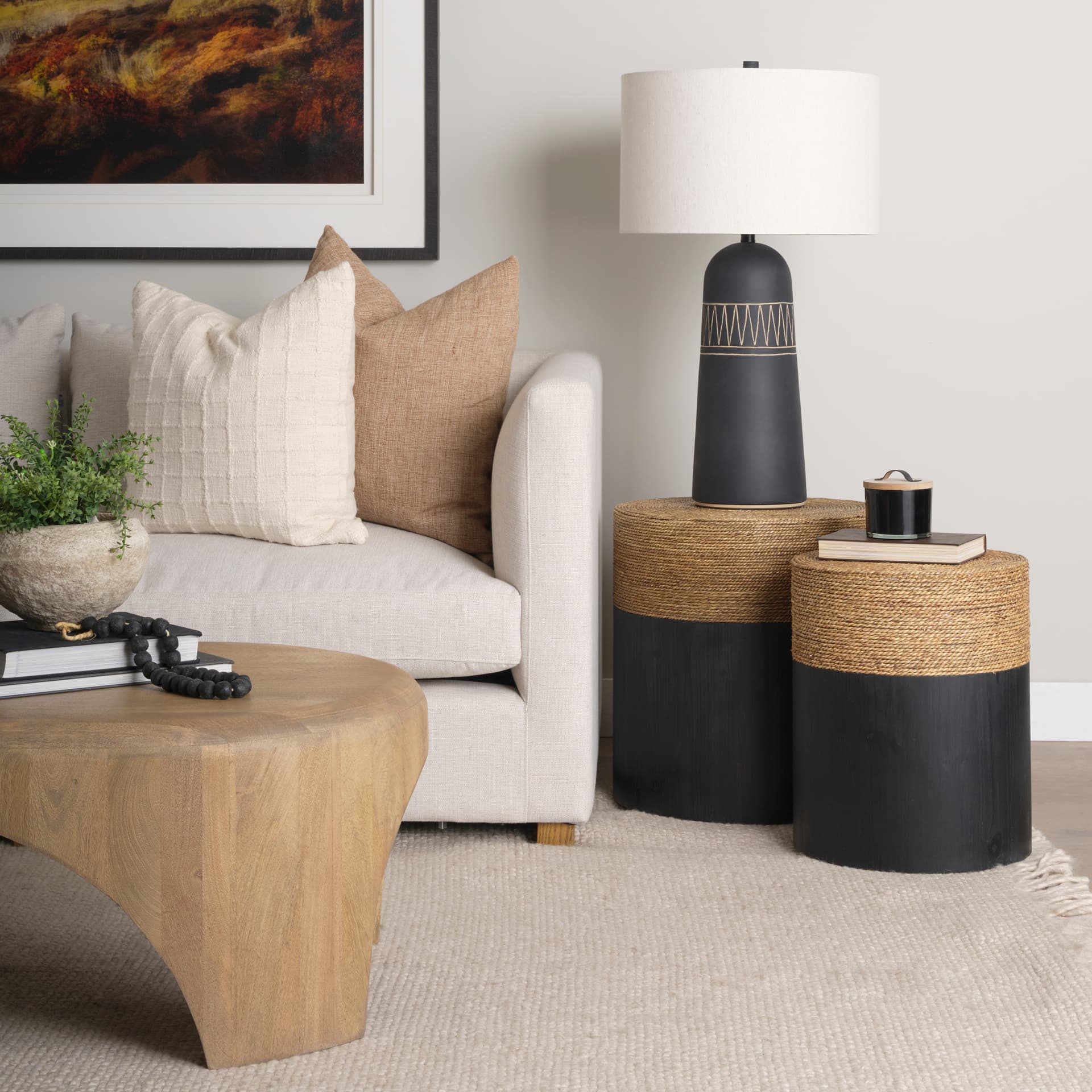 Wenopa Matte Black Wood w/ Natural Jute Accent Tables — in a styled room