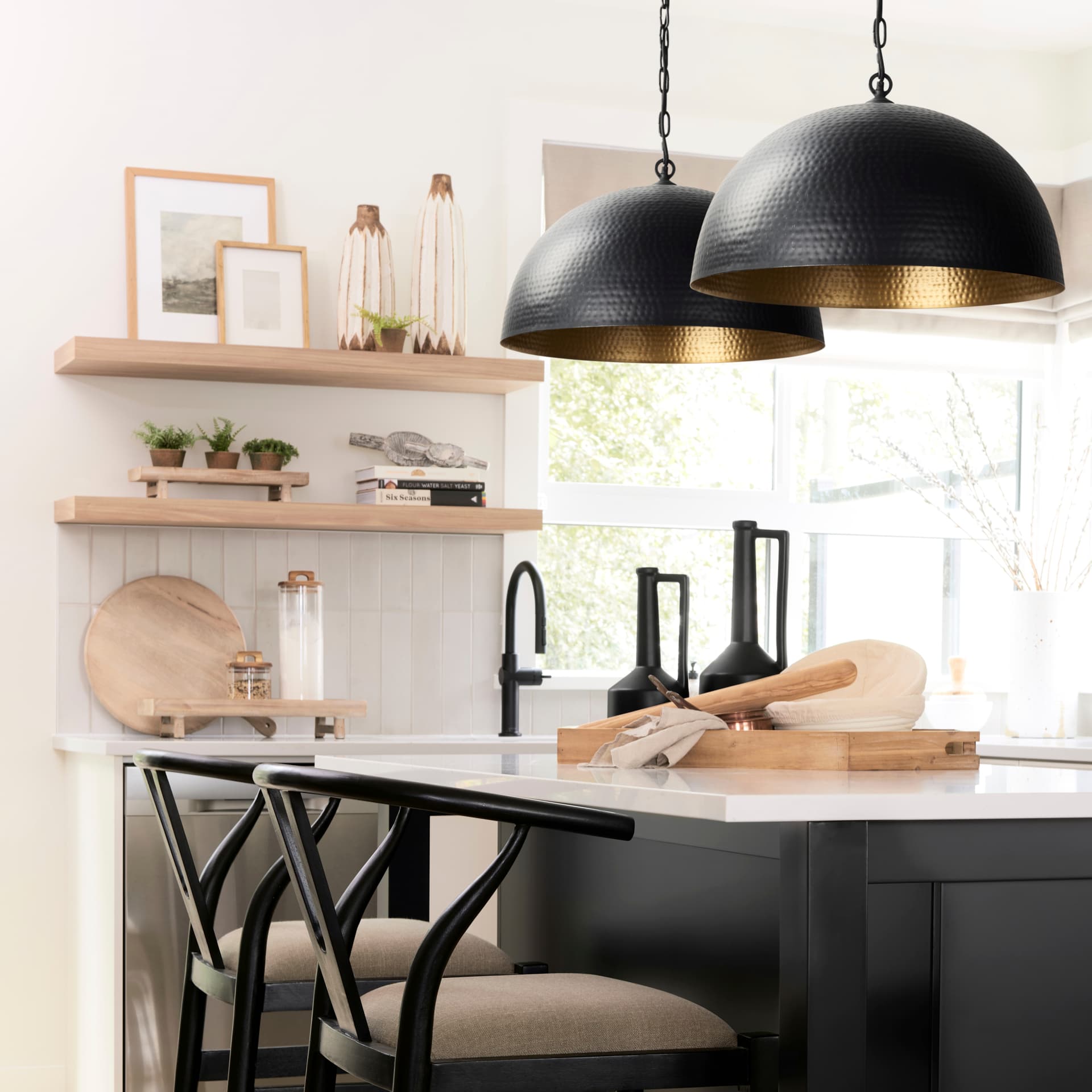 Karina 24" Round Matte Black Hammered Metal Dome Pendant Light — in a styled room