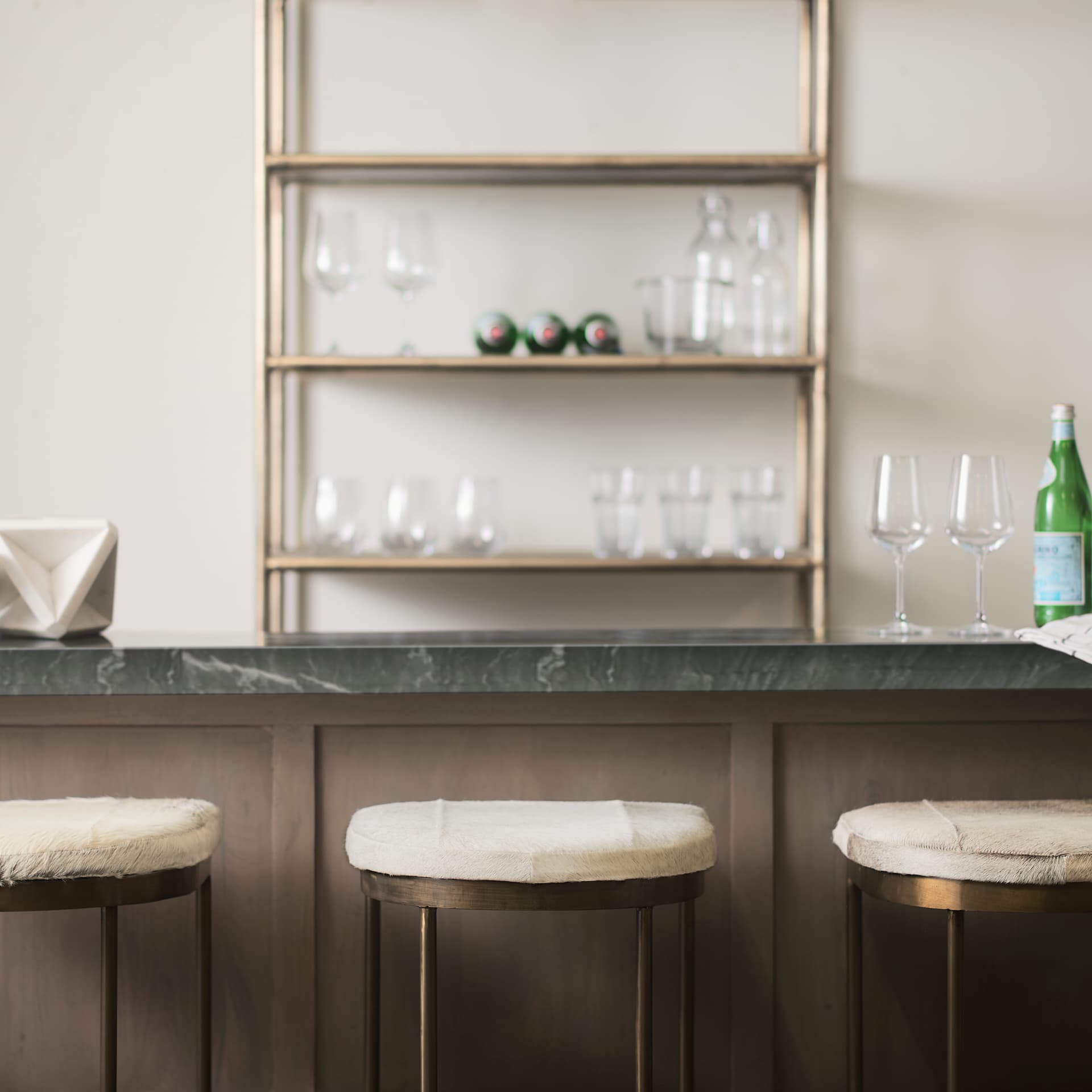 Millie Backless 30in Seat Bar Stool | Gray Hair-On-Hide w/ Gold Metal — in a styled room