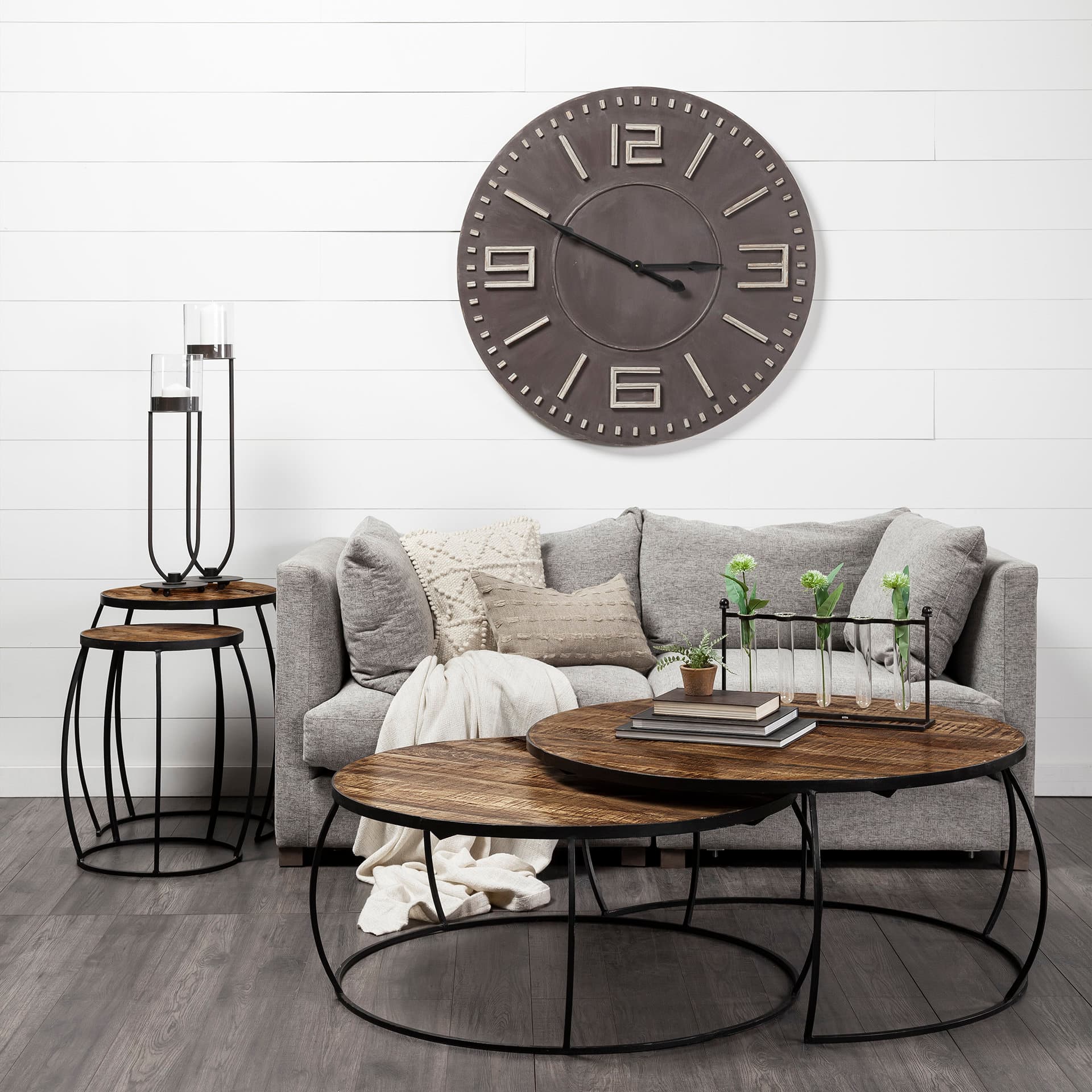 Clapp I Set of 2 (41" & 38") Round Brown Wood Top Black Iron Base Nesting Coffee Tables — in a styled room
