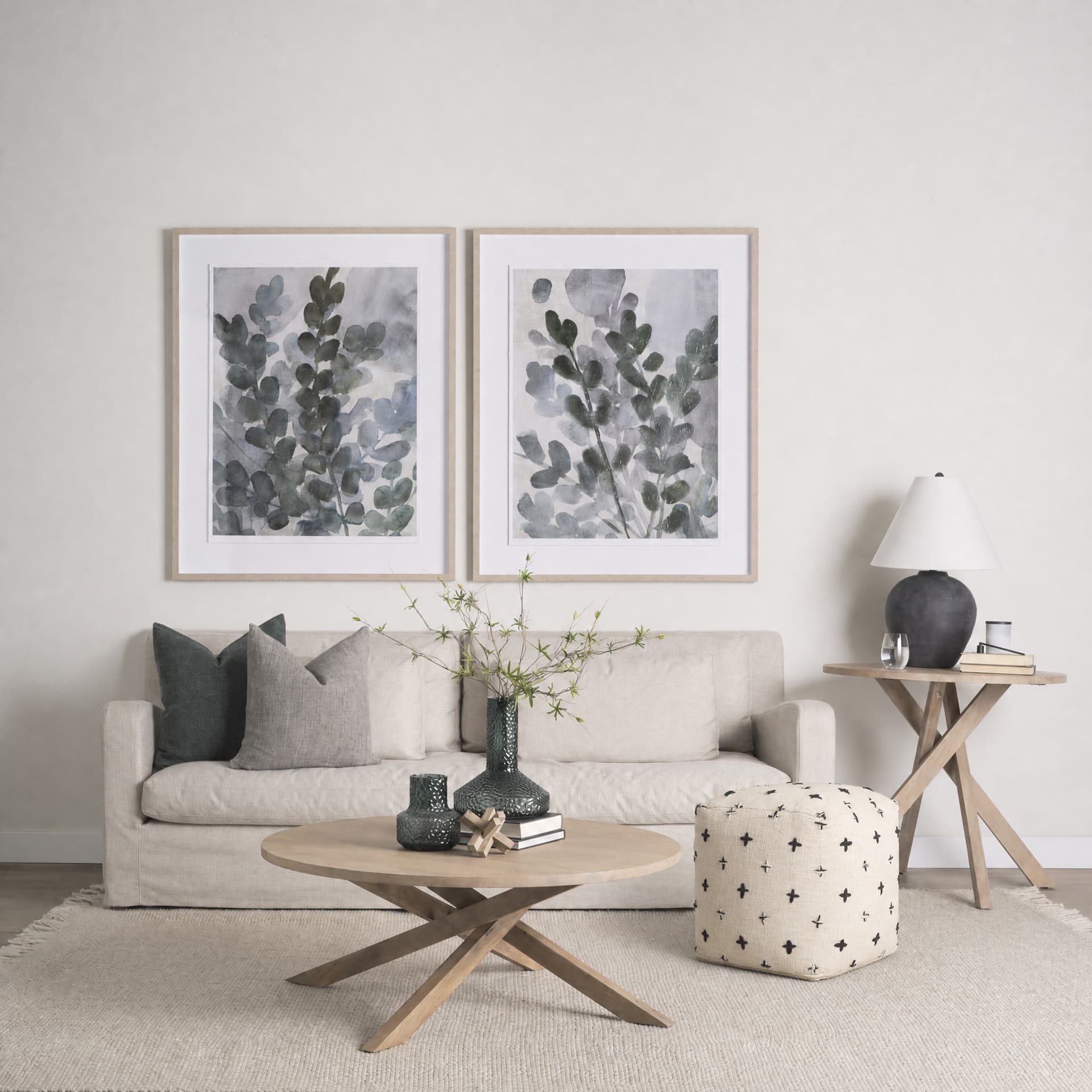 Saanvi Wool w/ Cream and Black Stitched Cross Patterned Pouf — in a styled room
