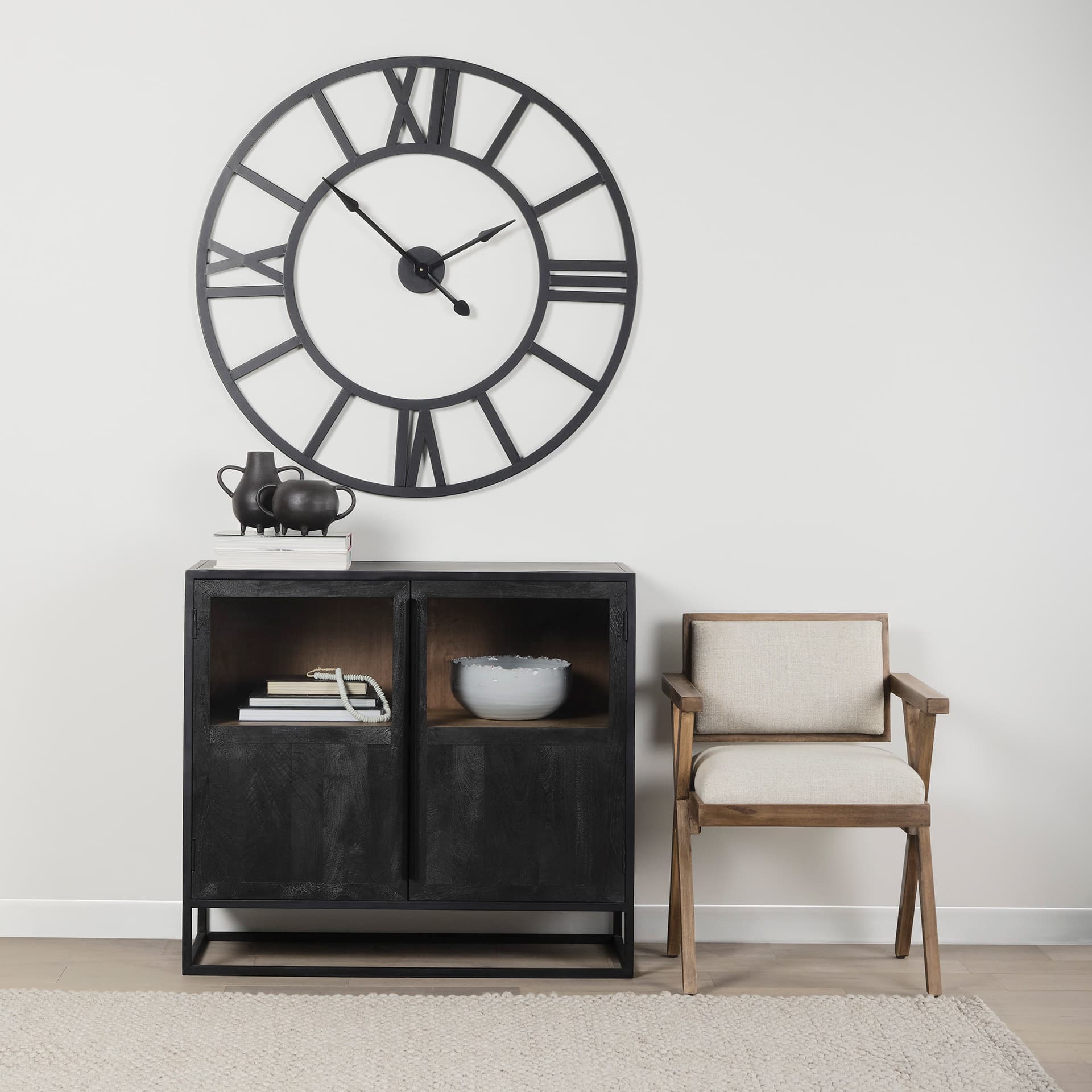 Stoke 42" Round Black Iron Wall Clock — in a styled room