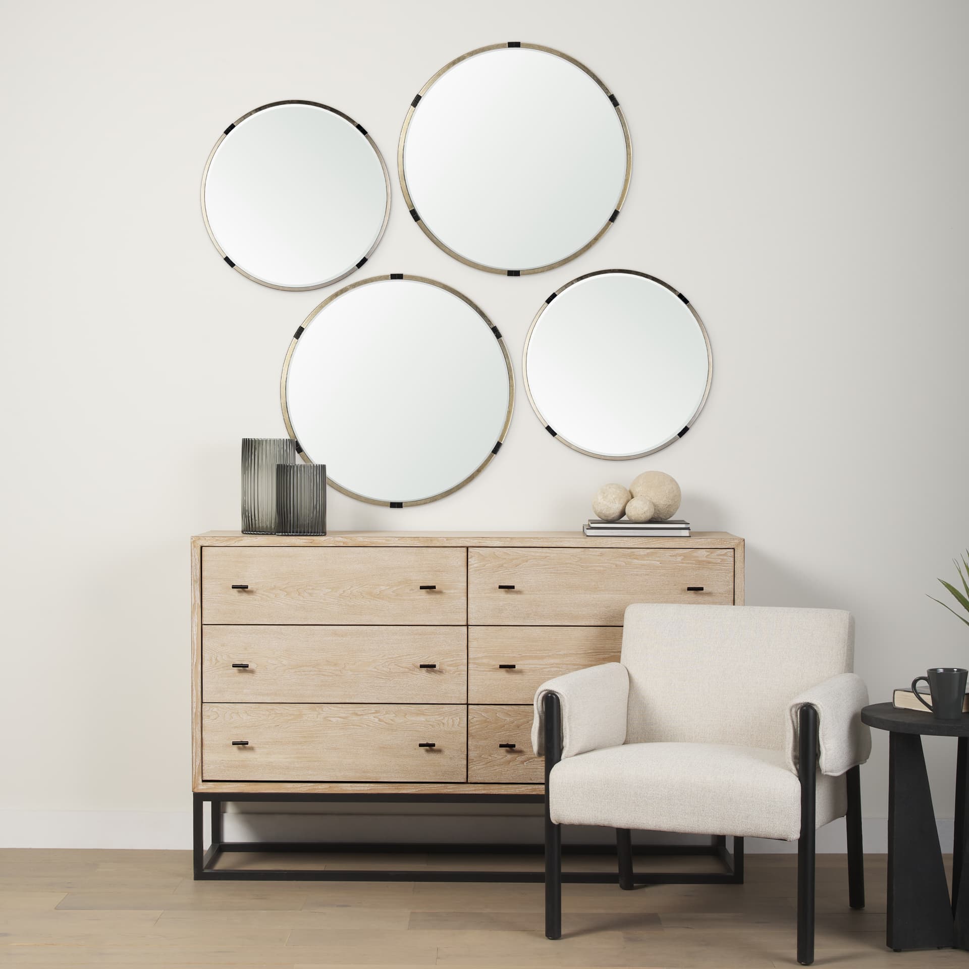 Melissa 28.5" Medium Round Gold Metal Wall Mirror — in a styled room