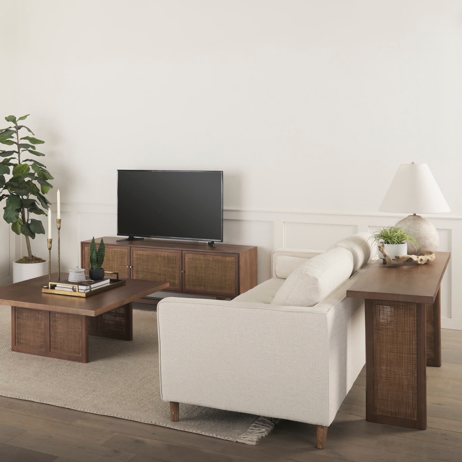 Grier 65" Medium Brown Wood W/ Cane Media Console — in a styled room