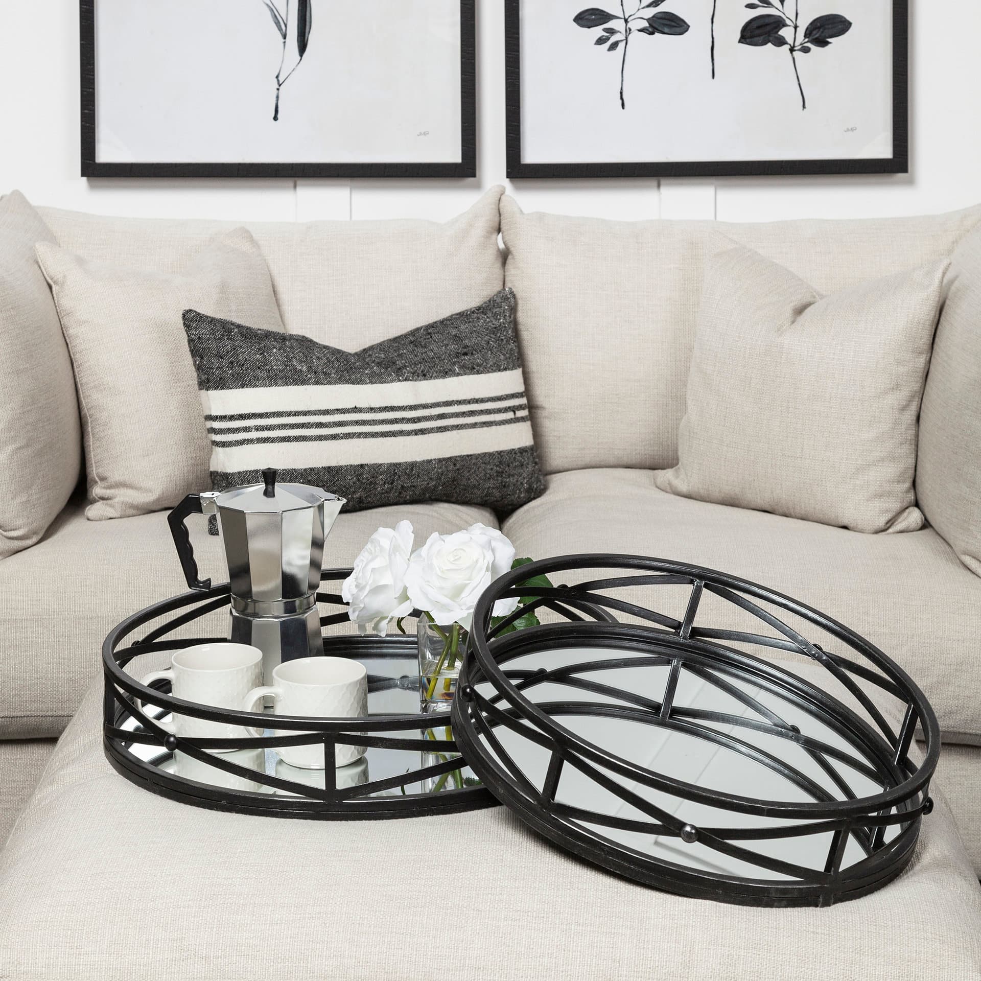 Piers (Set of 2) Black Metal Mirrored Round Trays — in a styled room