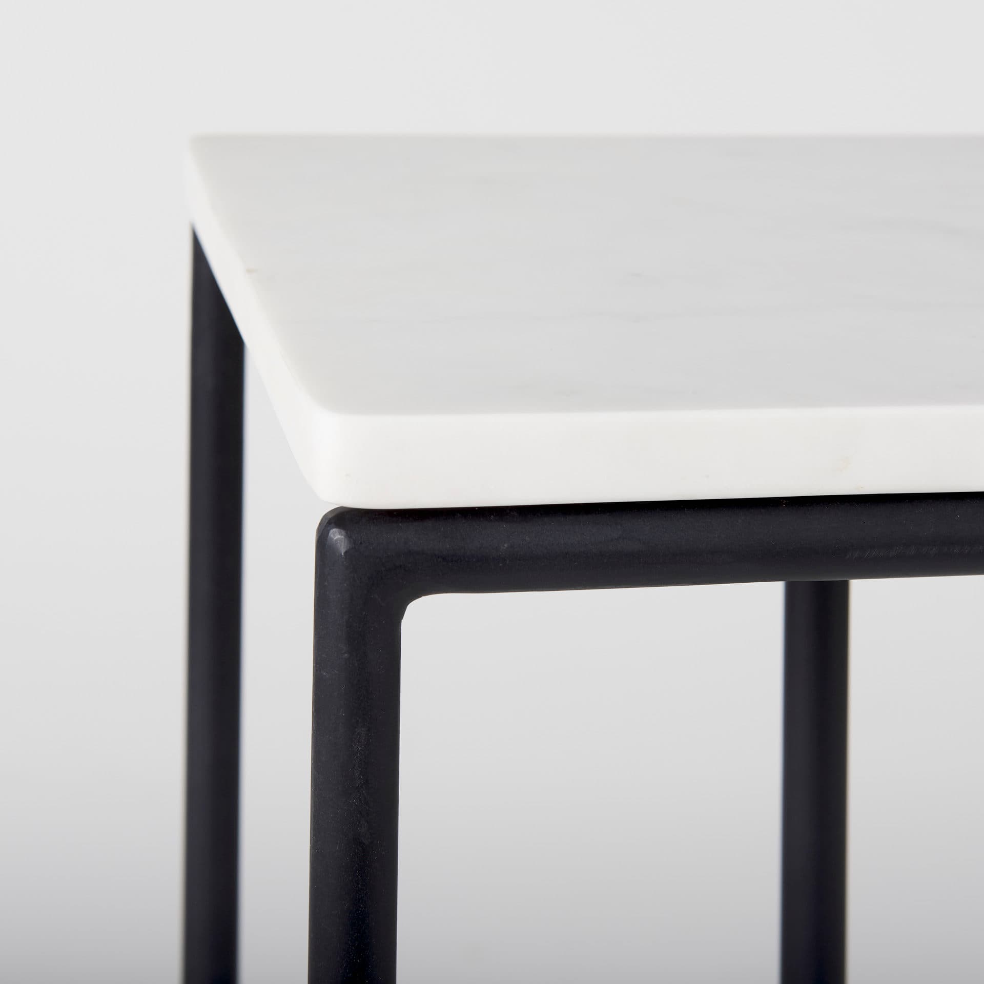Kyra 12.0L x 20.0W x 23.0H White Marble Top W/Black Iron Frame C-Shaped End and Side Table — product photograph