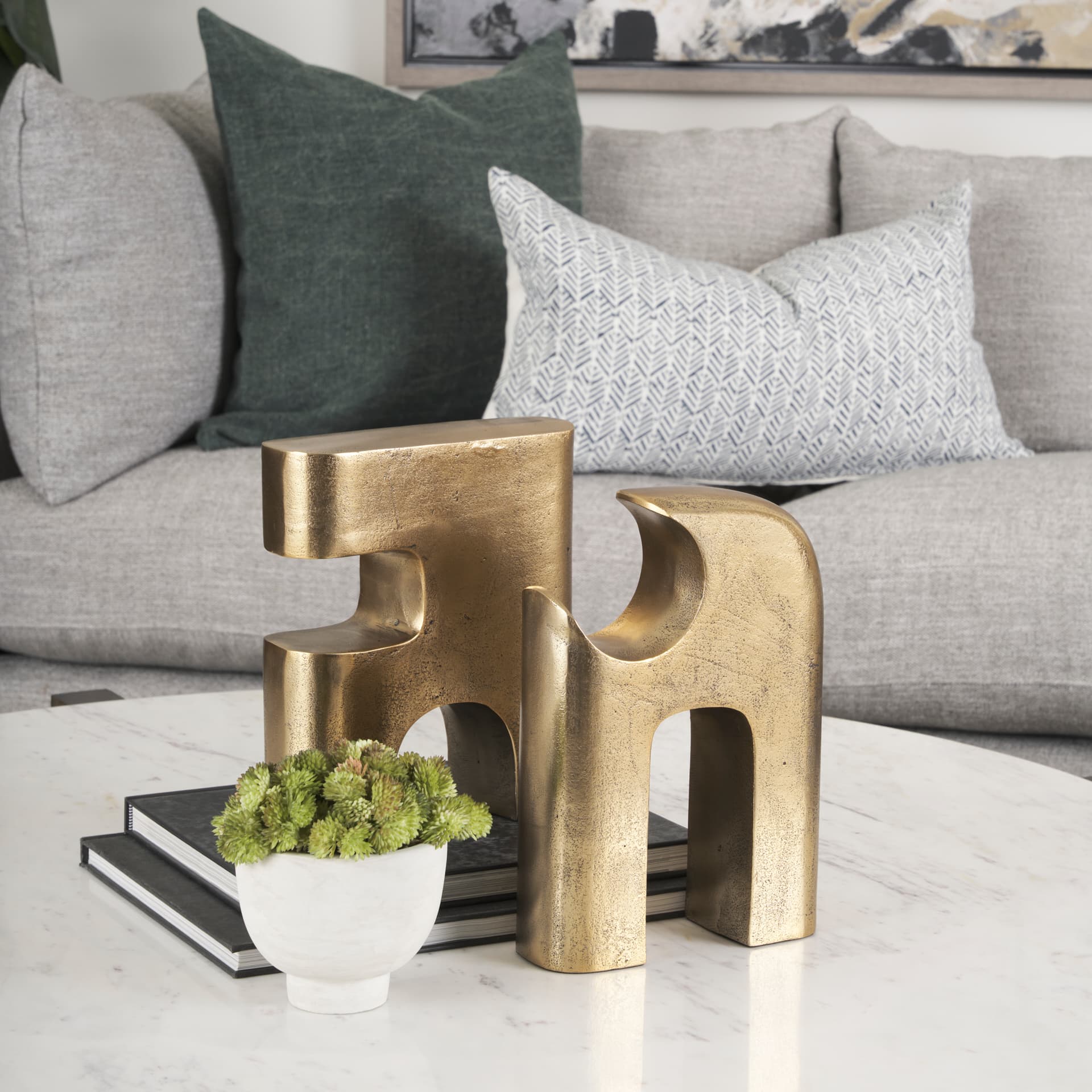 Renni Antiqued Brass Large Decorative Sculpture — in a styled room