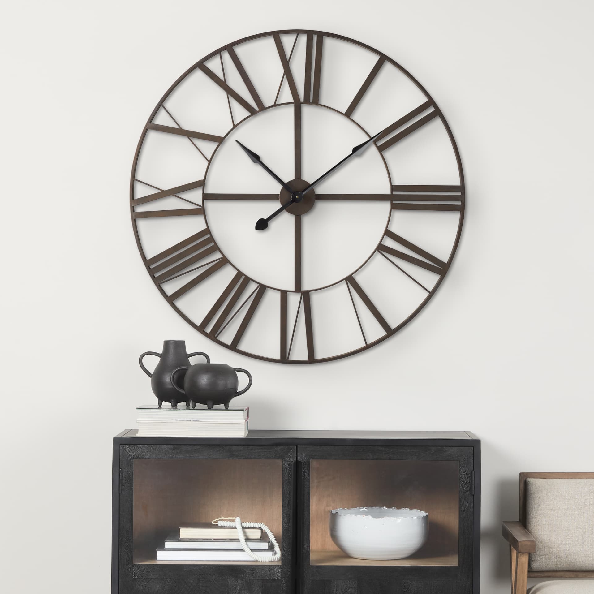 Pender 40.0L x 2.4W x 40.0H Black Iron Round Wall Clock — in a styled room