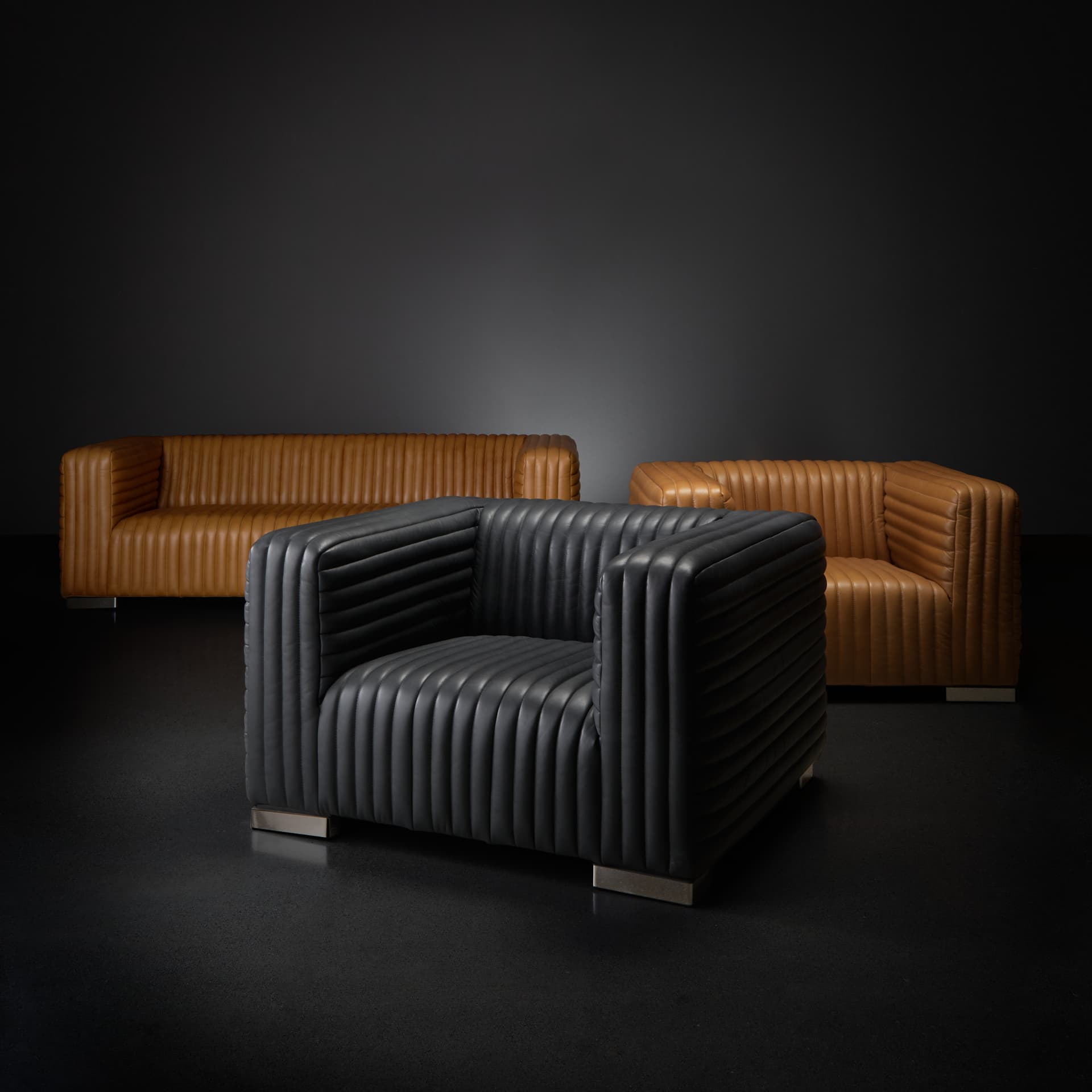Ricciardo Cognac Leather Upholstered Arm Chair — in a styled room