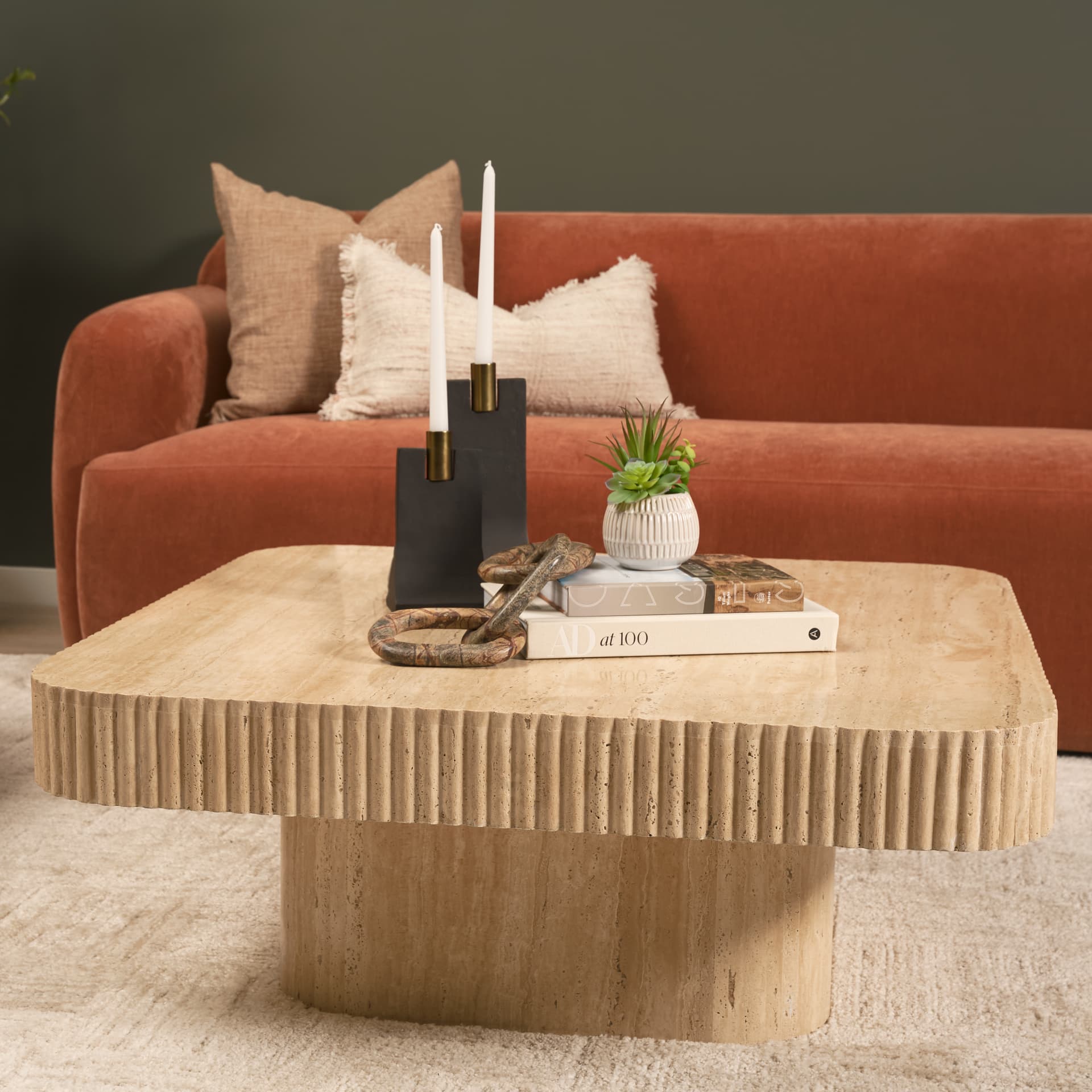Tavora Ribbed Square Travertine Coffee Table — in a styled room