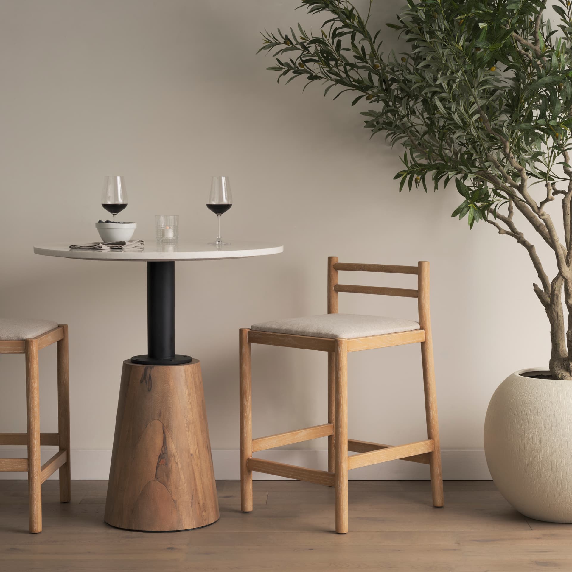 Sam Backless 25.87in Seat Counter Stool | Light Brown Wood w/ Fabric — in a styled room