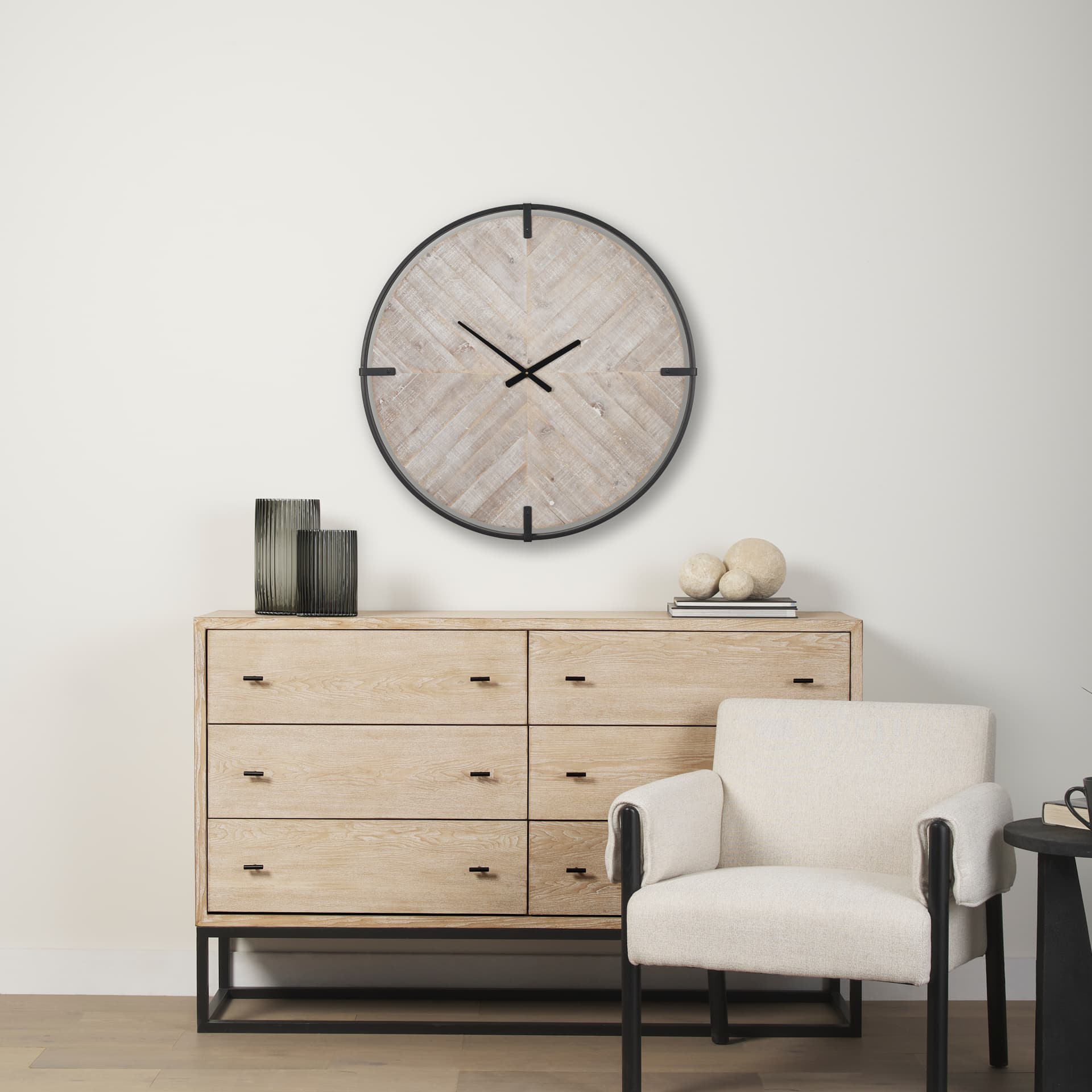 Rani Matte Black Metal w/ Wood Wall Clock — in a styled room