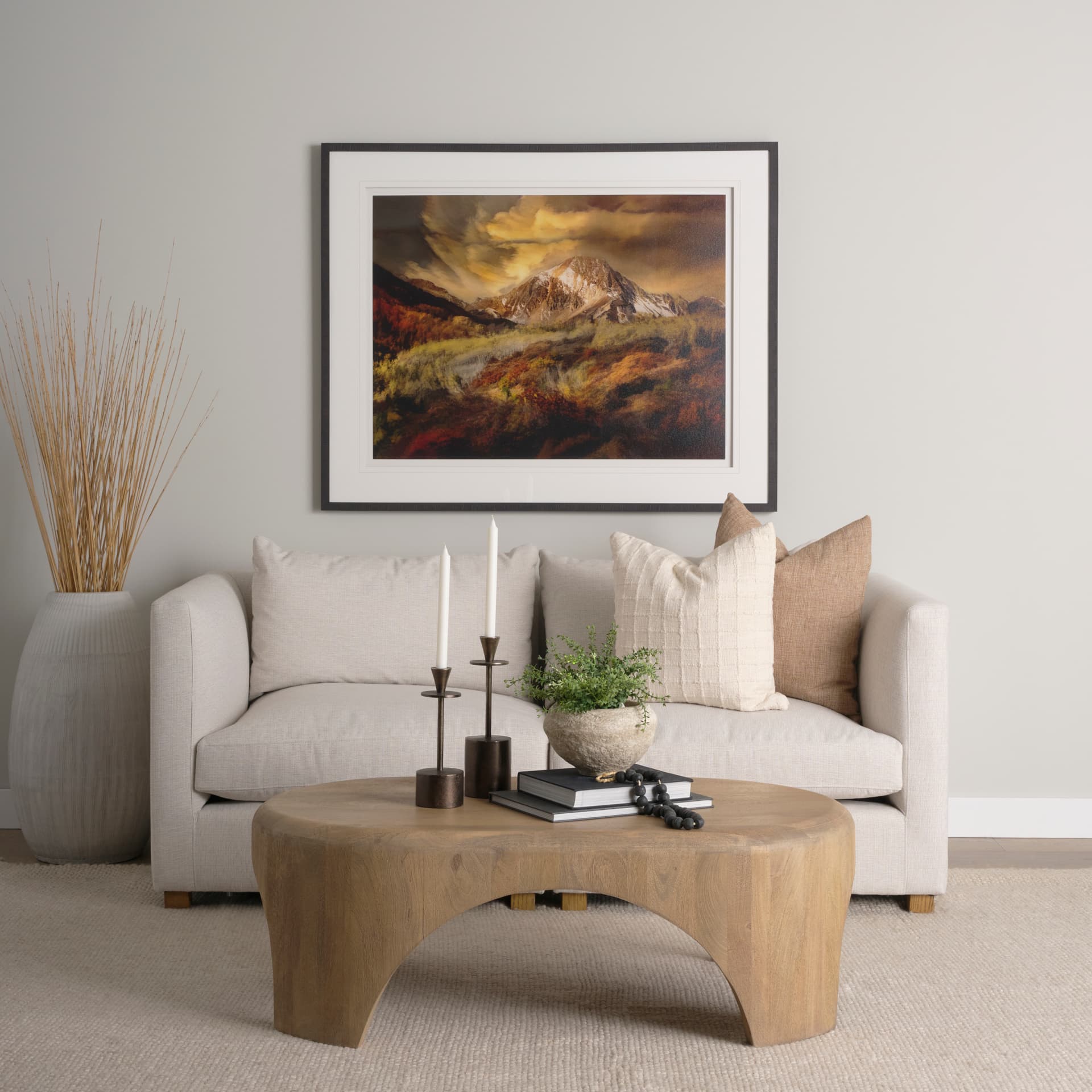 Shima Oval Light Brown Wood w/ Arched Legs Coffee Table — in a styled room