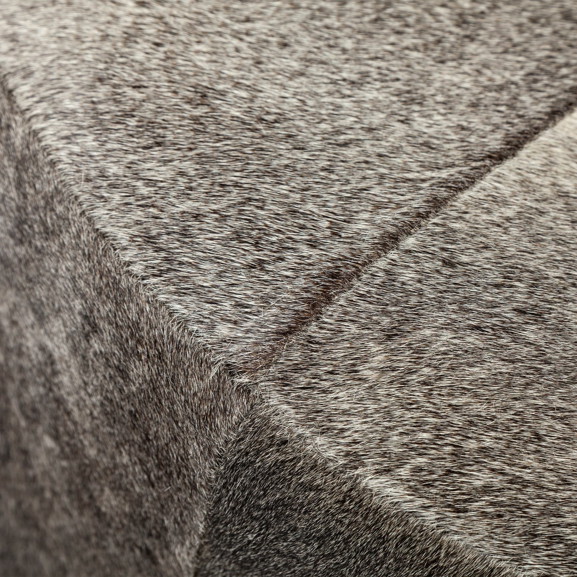 Zahavi I 23"H grey-toned hair-on-hide ottoman — product photograph