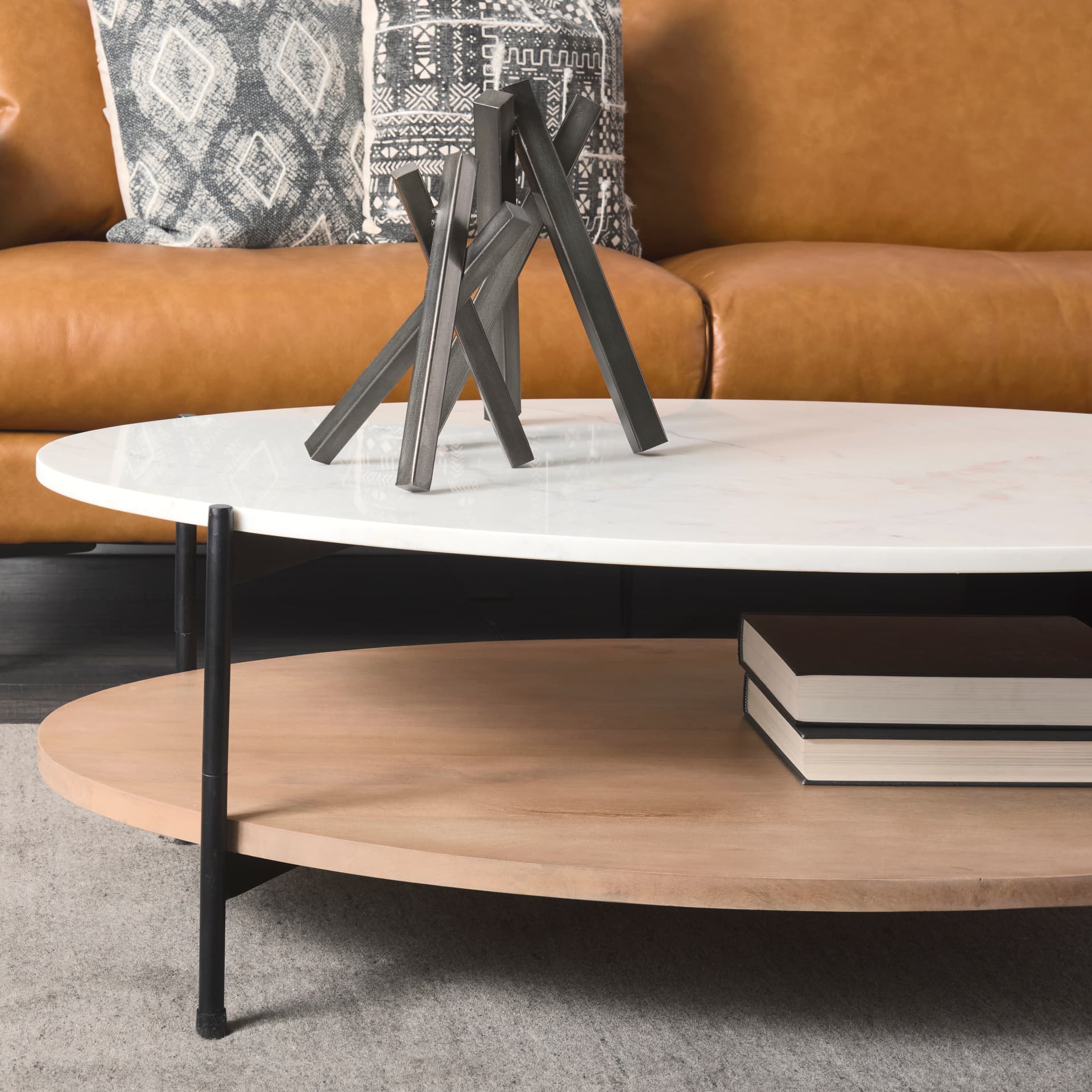 Larkin 48" Oval White Marble Top and Solid Wood Shelf w/ Black Metal Frame Coffee Table — product photograph