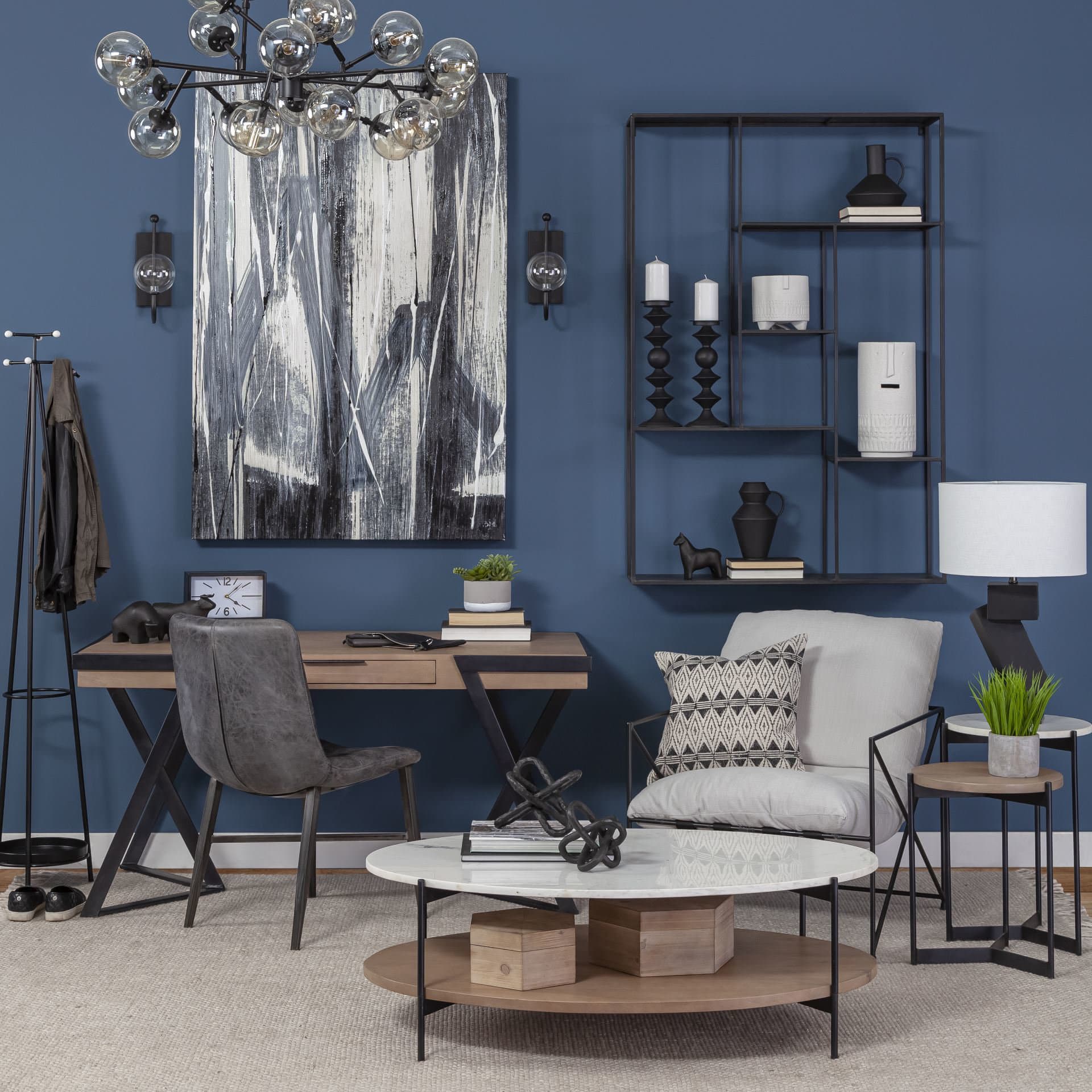 Larkin 48" Oval White Marble Top and Solid Wood Shelf w/ Black Metal Frame Coffee Table — in a styled room