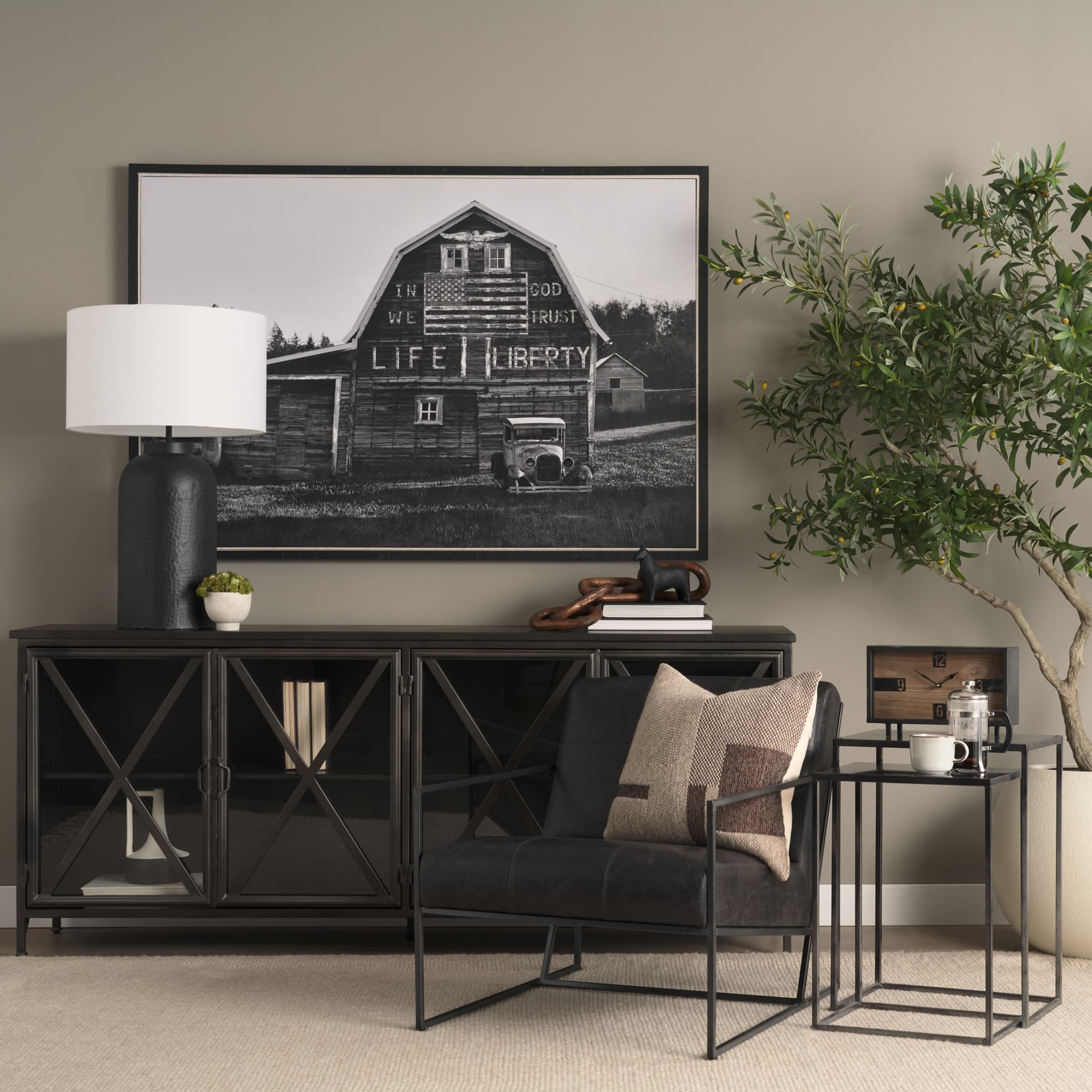 Stratton Gunmetal w/ Genuine Aged Black Leather Upholstered Accent Chair — in a styled room
