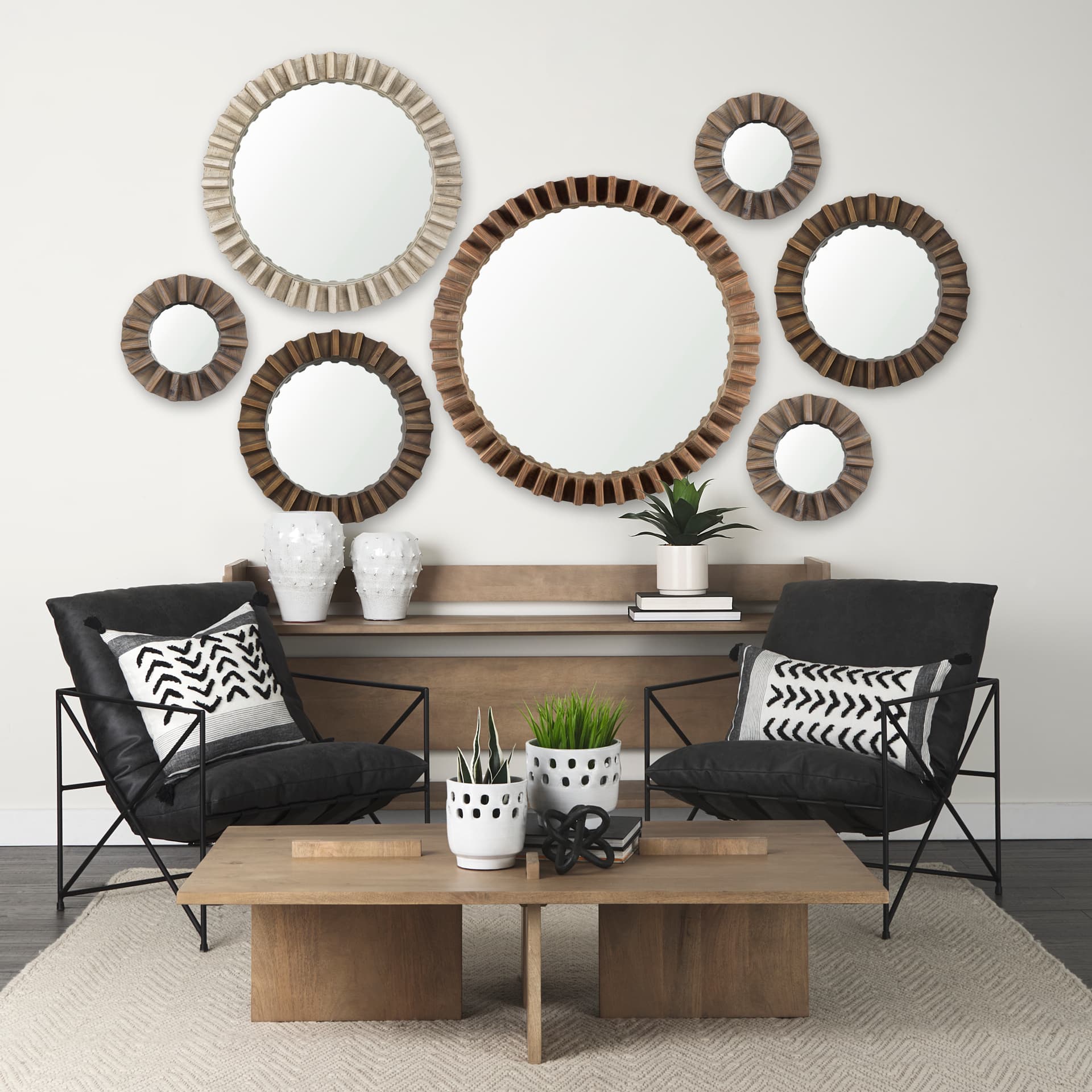 Sprocket 26" Round Brown Wood Frame Mirror — in a styled room