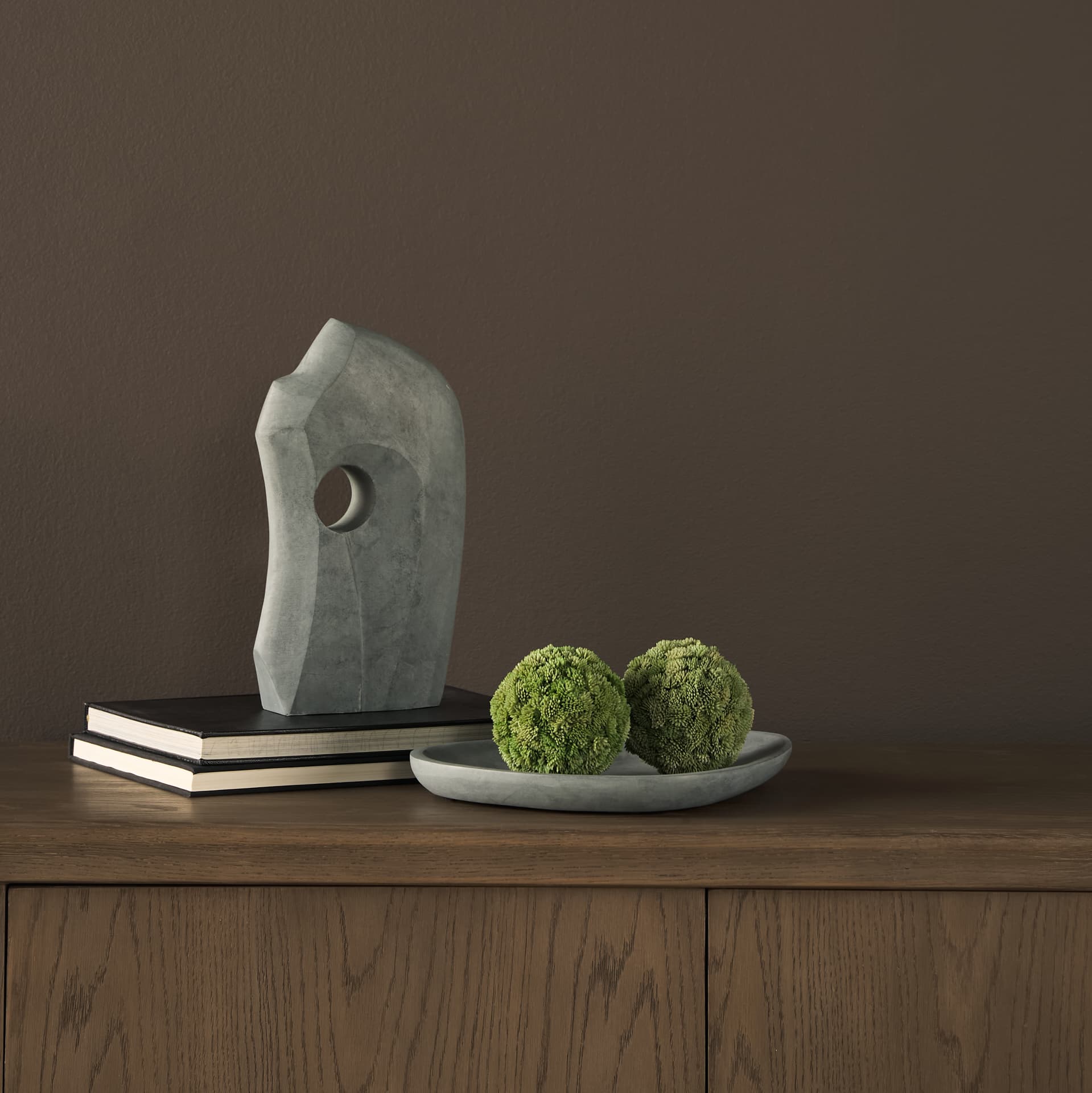 Tria Rounded Triangular Grey Marble Decorative Tray — in a styled room