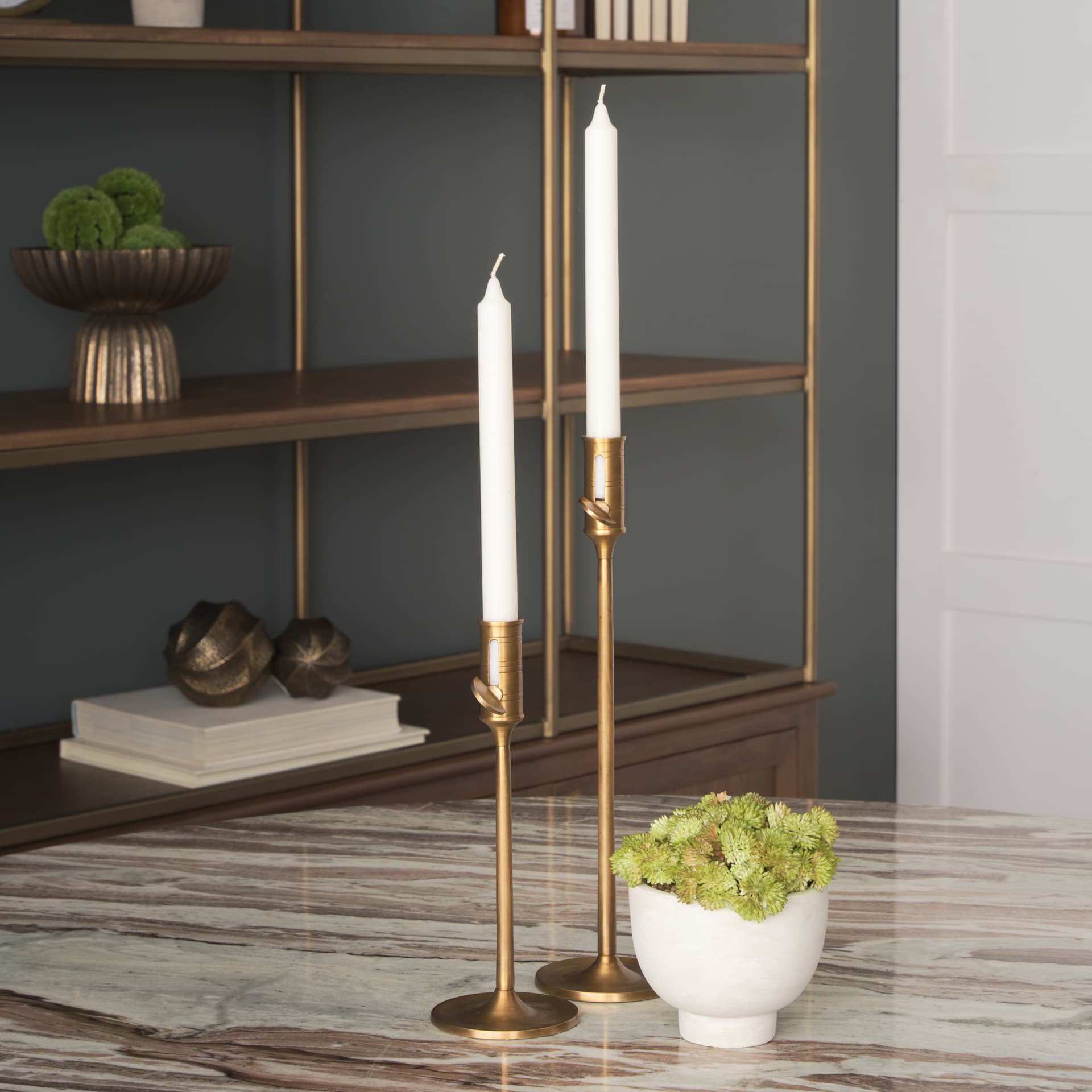 Chantria Large Solid Natural Brass Adjustable Taper Candle Holder — in a styled room