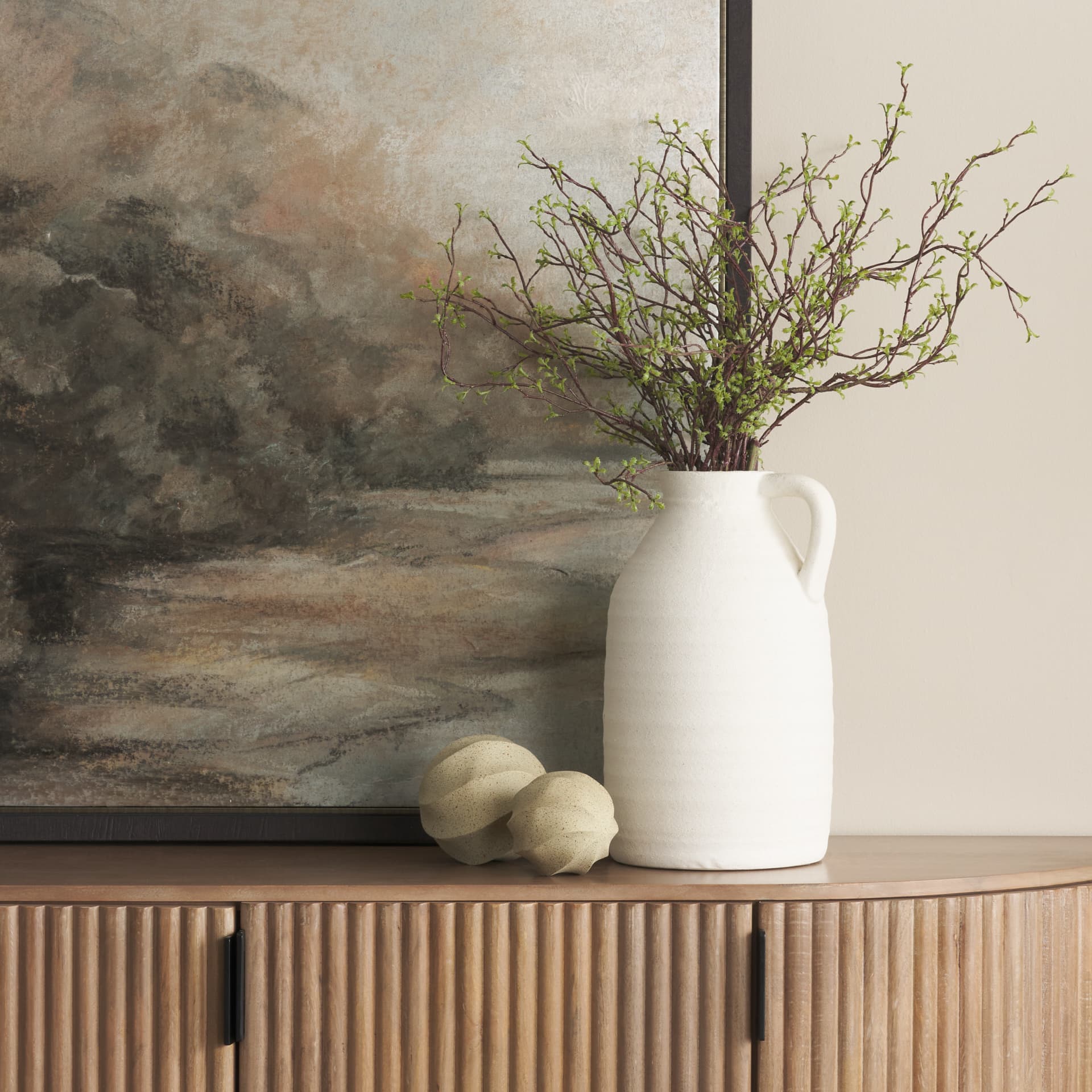 Imani Large Sculptural Textured Beige Metal Decorative Orb Object — in a styled room