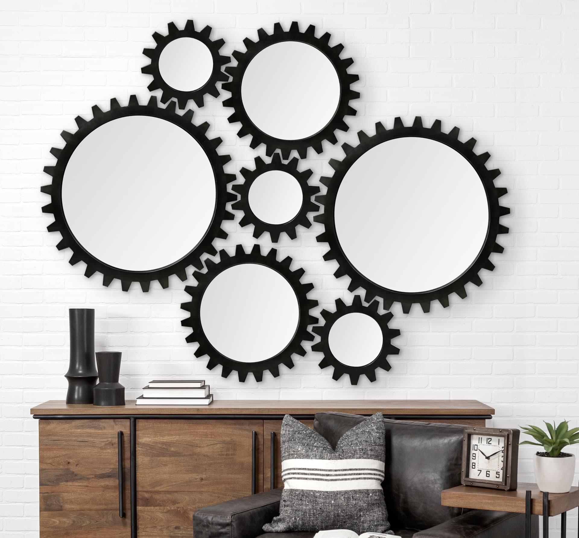 Alloy Cog 26" Round Black Metal Frame Mirror — in a styled room