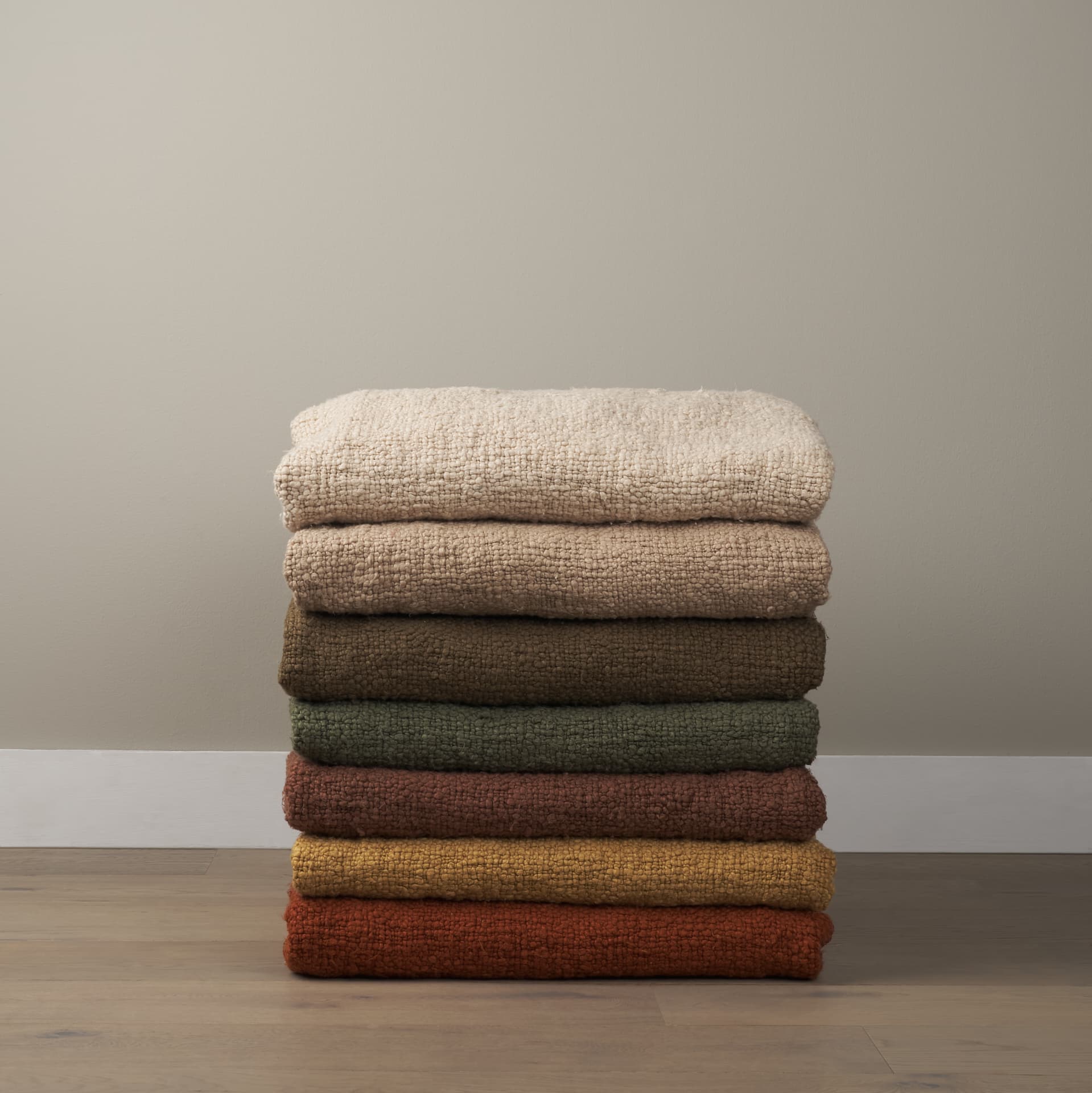Kambal Dark Olive Green Woven Cotton Throw Blanket — in a styled room