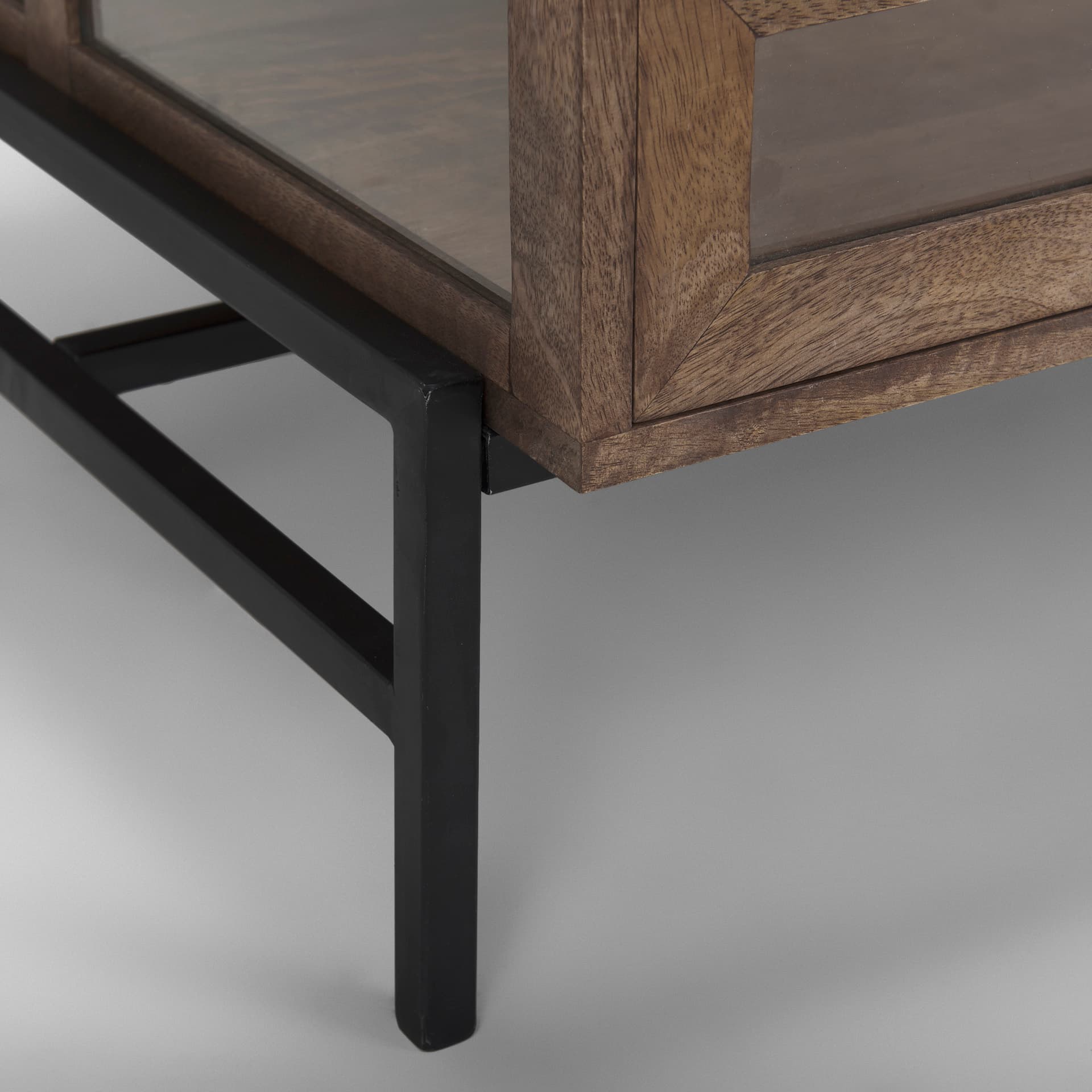 Arelius 49.5"L Rectangular Glass-Top Medium Brown Wood w/ Black Metal Base Display Coffee Table — product photograph