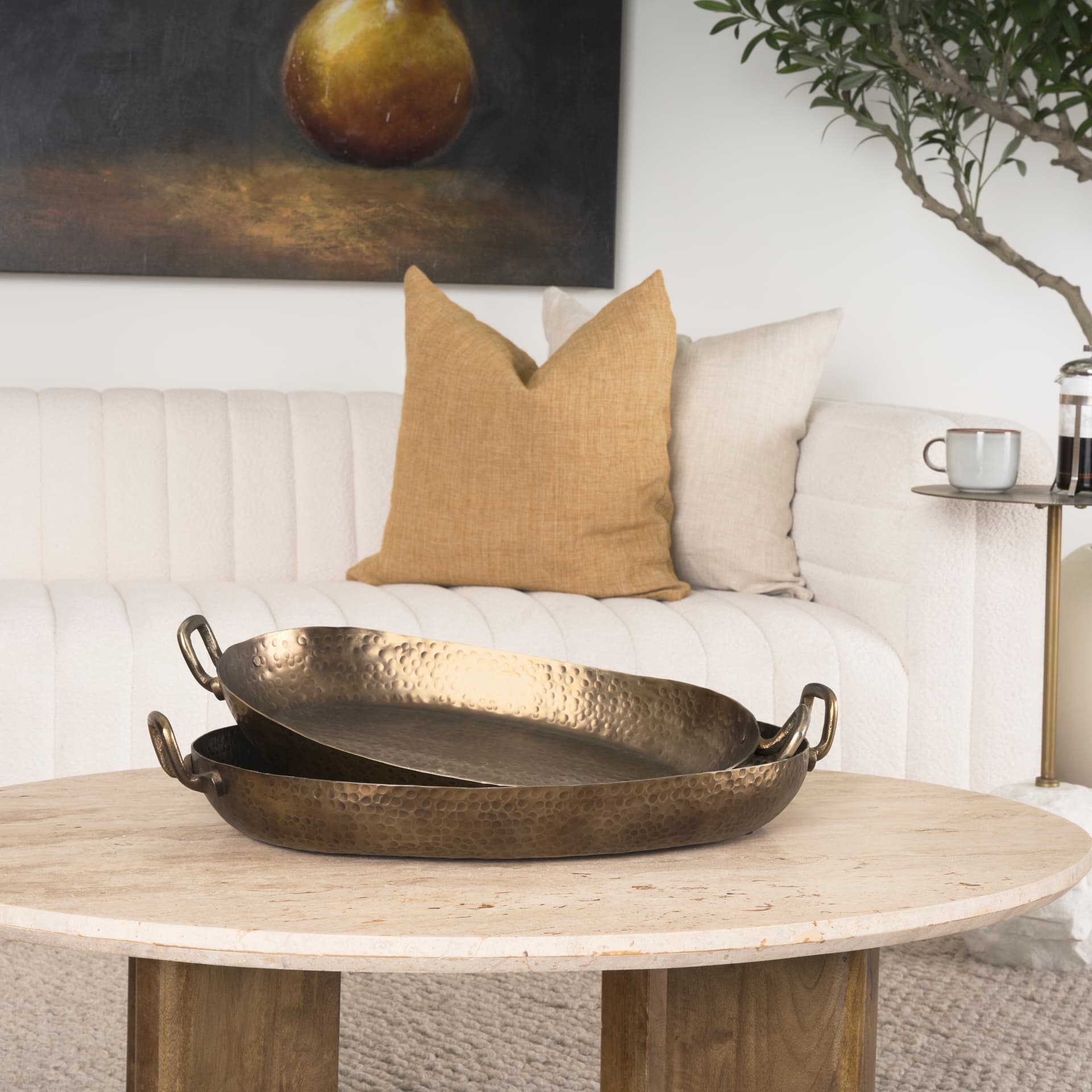 Pama Hammered Gold Metal Decorative Trays (Set of 2) — in a styled room