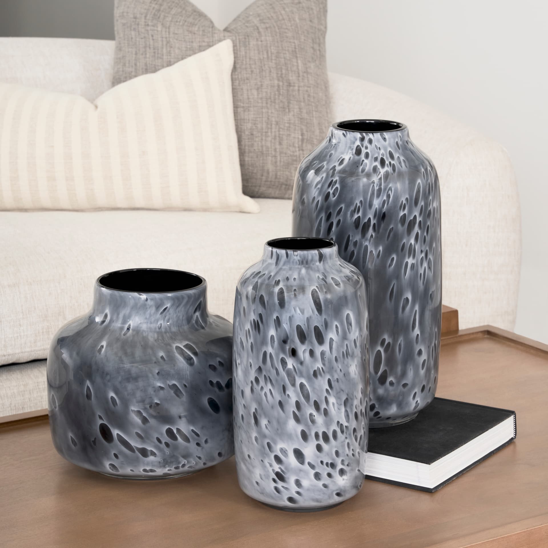 Masai Medium Black Mottled Glass Vase — in a styled room