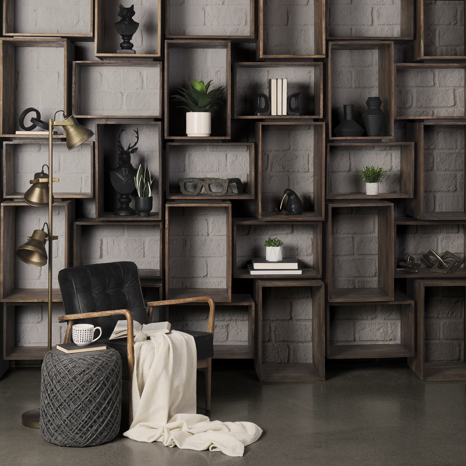 Allium Dark Gray Handwoven Wool Cylindrical Pouf — in a styled room